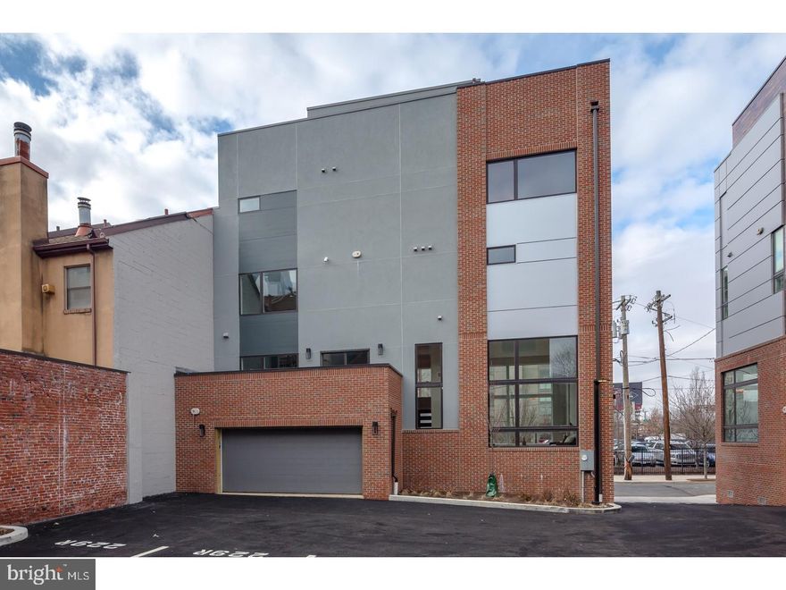 Corner new construction home with elevator, roof deck, 2-car garage and tax abatement!! Sitting just above Rittenhouse square in the Logan square section of center city. located in the Albert M. Greenfield school catchment and just a few blocks to the Comcast centers. This huge and beautiful home has enormous windows that drench the floor plan in natural light. Elegant finishes throughout including subzero, Bosch and wolf appliances, enormous granite kitchen, amazing bathrooms with double vanities and glass showers, wide plank hard wood floors throughout and designer fixtures.High efficiency heating and air. The master suite is spacious and private. The two story living room is captivating. The views are exceptional. This corner home has it all. truly one of a kind. walk to Rittenhouse square, Comcast center, 30th street station, Schuylkill river banks trail, Ben Franklin parkway, the Barnes museum and much more. Still time to customize SOME finishes. SHeetrock and tile has been installed.walk the building. meet the builder. See attached brochure. Tax abatement pending - tax amount is TBD.