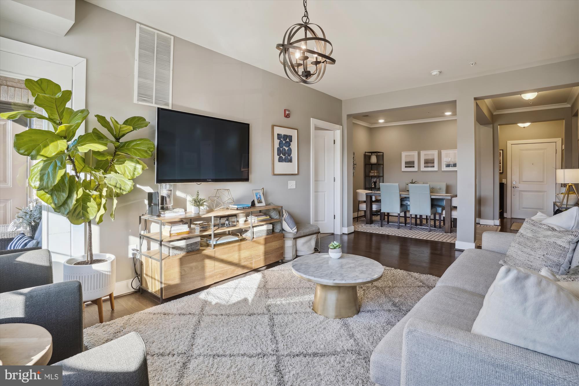 TWO BEDROOMS PLUS DEN: RARELY available penthouse unit at Flats at Metrowest.... 2 GARAGE PARKING SPOTS PLUS 3 VISITOR SPOTS! A short 4-minute WALK to the Vienna/Fairfax Orange Line Metro...ONE STOP TO MOSAIC... Inside this 1,375 sq ft unit, high ceilings and wide plank wood floors amplify the natural light, creating a bright, airy, and expansive feel. The Chef's Kitchen is a true highlight, featuring a gas range, stainless steel appliances, a generous walk-in pantry, and integrated wine storage—perfect for entertaining. The open-concept design flows into a sun-drenched living and dining area, featuring OVERSIZED windows and access to your private balcony. The thoughtful split-bedroom layout ensures maximum privacy. The primary suite is a true retreat, boasting a large bedroom and an adjacent, sun-filled den—ideal for a dedicated home office or fitness space. Unwind in the Spa-Inspired Primary Bath with its large walk-in shower, built-in bench, dual vanity sinks, and stunning custom built-in cabinetry. Organization is effortless  with the expanded walk-in closet featuring designer custom-built ins and shelving. The unit includes two reserved, tandem parking spots in the secured garage. Your new home is centrally located: a quick walk to Pan Am Shopping Center and minutes from The Mosaic District, Town of Vienna, and Tysons.
View the VIRTUAL TOUR LINK and schedule your private showing today!