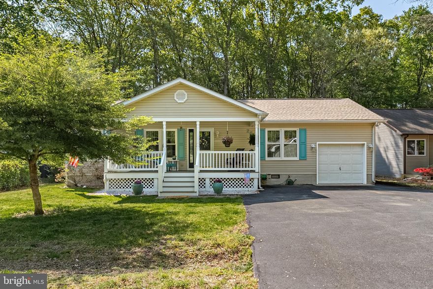 Welcome to this well-maintained 3-bedroom, 2-bathroom ranch-style home nestled in the heart of Ocean Pines! Designed with a split-bedroom floor plan for added privacy, this home offers functionality, updates, and plenty of charm. 
Step into a bright and open living area featuring laminate flooring, a cozy layout, and a seamless flow into the dining and kitchen spaces. The kitchen is a equipped with stainless steel appliances (2013), a newer refrigerator (2019), a pantry, and a breakfast bar . Just off the kitchen, enjoy your morning coffee in the enclosed porch (119 sq ft) with its own heat/air wall unit, perfect for year-round use. The spacious primary suite offers a remodeled full shower and is thoughtfully separated from the guest bedrooms for maximum privacy. A separate laundry room includes a stacked washer/dryer, utility sink, and extra storage. Additional features include a gas water heater, gas heat, and pull-down attic access. Outside, enjoy the covered composite front porch, composite rear decking, paver patio, and a 1-car garage with an extra fridge and overhead storage. Many updates!  A new roof (2020), new shed roof (2023), new windows & doors (2023), lifetime gutter guards, and a water treatment system offer peace of mind and long-term value. The sunroom is an ideal space to unwind or entertain. A large pantry off the kitchen can be used as an office.