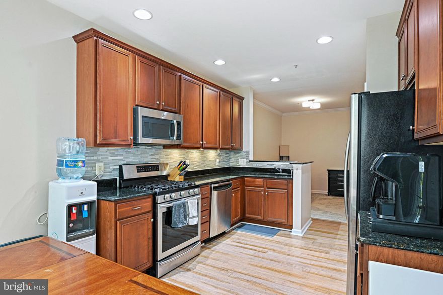 **Open House this Saturday (11/22) 1-3pm and  Sunday (11/23) 1-3pm** 

Step inside this spacious Worthington model and feel instantly at home. With over 1,500 square feet, this 2-bedroom, 2.5-bath townhouse-style condo strikes the perfect balance of comfort and space. It’s light-filled, easy to live in, and designed for people who want everyday life to feel a little simpler and a lot more enjoyable.

The main level flows effortlessly, with bamboo floors connecting the living room, dining room, and kitchen. Sunlight pours in through the windows, giving everything that warm, happy glow that makes you want to kick off your shoes and stay awhile. Step out onto your private balcony and take in the peaceful view of the community’s open space and the W&OD Trail — it’s the perfect spot for morning coffee or a quiet evening to unwind.

The kitchen blends style and function with cherry cabinets, granite countertops, and stainless steel GE Profile appliances. The breakfast area opens directly to the balcony, making it a great setup for cooking, chatting, and entertaining all at once.

Upstairs, the primary suite feels like your own little retreat — complete with one spacious walk-in closet plus a bonus second closet, and a private ensuite bath with dual sinks, a soaking tub, and a separate shower. The second bedroom is also generously sized, with its own full bath nearby, and the laundry room is right there on the same level for easy access.

Life in Belmont Country Club means resort-style amenities and a true sense of community. You’ll have access to pools, tennis courts, walking trails, a fitness center, on-site dining, and a clubhouse full of activities. Golf memberships are available too, offering access to the championship course and plenty of social events throughout the year.

And the location? It’s hard to beat. You’re close to everything — shopping, dining, Loudoun Hospital, parks, the W&OD Trail, Dulles Airport, and the Metro.

With two assigned parking spaces, a private balcony, and a welcoming layout that just feels good to live in, this home is the perfect mix of comfort, convenience, and community. Welcome home to Belmont Country Club — where everyday life feels just a little bit better.