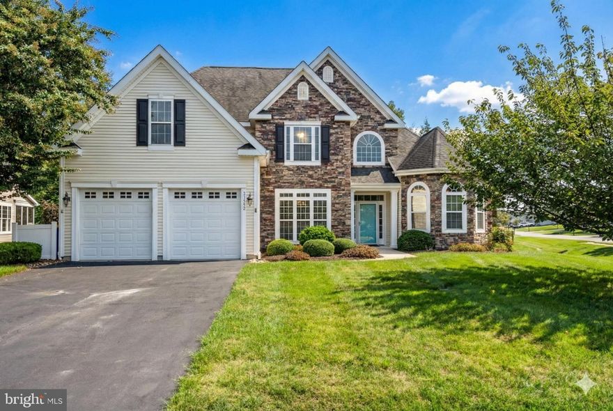 PREPARE TO FALL IN LOVE!  This stunning, stately stone-front residence isn't just a home—it's a luxurious, low-maintenance lifestyle waiting for you. Situated on a premium corner lot with breathtaking, private wooded views, the moment you enter, you'll feel the open, airy flow designed for effortless first-floor living.  Imagine enjoying your morning coffee in the bright, year-round sunroom or relaxing in the renovated 1st-floor Primary Suite (complete with a spa-like bath featuring Shower Guard). Forget renovation headaches—this home is a rare find, having been lightly used as a second residence, it's in absolutely pristine, move-in ready condition.  UPGRADES galore include Brazilian cherry flooring, a custom kitchen island, high-end appliances, and recently replaced HVAC. The sellers even covered the special HOA assessment—a HUGE savings waiting for you!  You're just a short stroll from the spectacular 24,000 sq. ft. Independence Hall Clubhouse, offering indoor/outdoor pools, a fitness center, and a vibrant social calendar. Don't miss the chance to experience this unique blend of space, cozy comfort, and luxury firsthand. Ask your agent for the full list of features!  Better yet - come see it in person!!