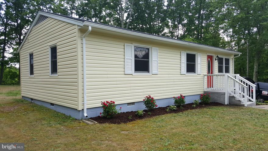 Recently updated with hand scraped laminate wood floors through out!  Gleaming white cabinets with coordinating granite counter tops! Brand new stainless steel appliances. Bathroom has lovely tile and new modern vanity.  Freshly painted. New HVAC, roof and siding! Nice big deck and large lot. Large parking area!  Ready for new owners! Affordable!