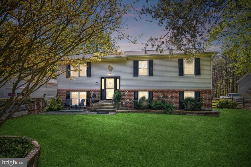 Welcome to 460 Laura Lane in Lusby, a home where thoughtful design and meticulous care merge to create an effortless living experience. This freshly painted residence with new crown molding stands poised to welcome its new owners, offering three bedrooms and two full bathrooms on the upper level, along with the potential for a fourth bedroom in the lower level, complete with an additional full bathroom. Notably, the lower level boasts the beginnings of a kitchenette, featuring a sink and counter space, opening up possibilities for extended living arrangements or recreational use.  Lower level floor was recently painted.  New fans have been added throughout the home.    
      
Approaching the corner lot home, one immediately appreciates the well-maintained fenced front yard. Yet, the true delight awaits in the expansive backyard—a flat expanse of land adorned with a covered feeder for the birds, a tranquil pond for fish, and a serene ambiance under the shade of mature trees. Whether hosting gatherings, gardening, or simply unwinding amidst nature's embrace, this backyard offers endless possibilities for enjoyment and relaxation.

Convenience meets recreation with a location just 15 minutes from Solomon's Island. Here, residents can indulge in leisurely riverside strolls, exhilarating kayaking expeditions, or exquisite dining experiences at one of the many waterfront restaurants. For nature enthusiasts, the proximity to Calvert Cliffs—merely 4 miles away—and Cove Point Park—just 5 miles distant—presents abundant opportunities for hiking and outdoor exploration. Additionally, with Patuxent Naval Base a mere 17 miles away, this location offers easy access to employment opportunities and military services.

Some updates and features include:  The upstairs carpet with extra padding was replaced  3 years ago, roof was replaced in 2018 and has a lifetime warranty, well pump replaced in 2016 and washing machine and dishwasher replaced in 2022.  Timers have been set up on the front and back faucets as well as water flow to the pond.  Transition table have been added so there is not need to put the grocery on the ground while opening the gate.  

 In summary, 460 Laura Lane encapsulates the essence of comfortable living, offering not just a home, but a lifestyle enriched by thoughtful amenities and a prime location brimming with recreational possibilities.