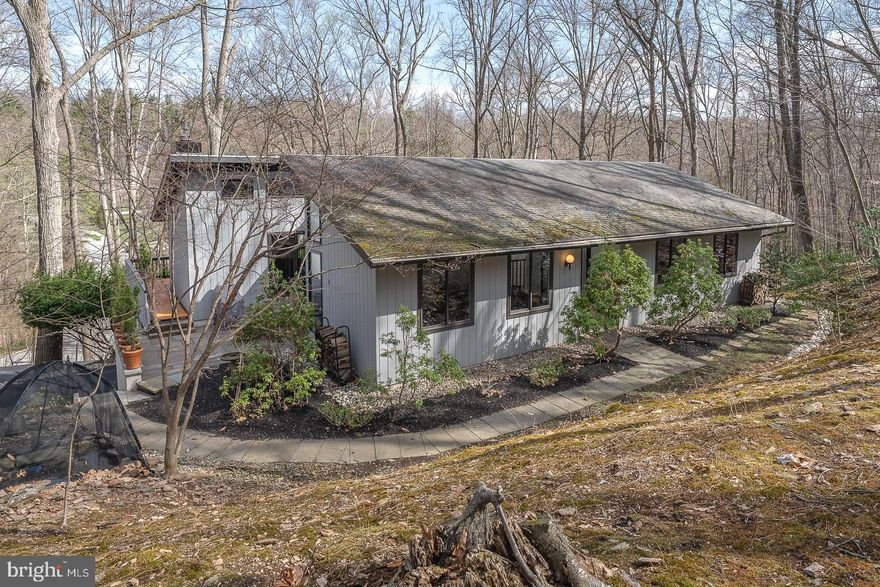 This custom contemporary is located in the desirable Gulph Mills section of Upper Merion Township near Gypsy Woods Bird Sanctuary, this bright and spacious home is ready for new owners! The unique floorplan allows for plenty of flexible living spaces, perfectly suiting a modern, busy lifestyle. Step inside the Entry Hall with hardwood floor to discover an open layout featuring a large living room with high ceilings, and  picture windows. The formal dining room with a window wall  flows into the first floor Family room with gas fireplace and built-ins. The chef’s kitchen with cathedral ceiling, granite countertops, custom cabinetry, pantry wall, breakfast nook and access door to deck.  Outside the Family room is the newer slate terrace with Koi pond and waterfall. The main level will find the primary bedroom with en suite bathroom,  2 walk-in closets. There are 2 additional bedrooms (one with cedar closet) that share a newer hall bathroom.  There is a Laundry room that finishes off the main level.  The lower level has an open floorplan waiting to be finished with composite flooring and outside access to the 2 car garage and backyard for wildlife viewing.  The utilities, new heating / airconditioning system, and storage area/workshop/ exercise area are also on this level. The yard is covered with enchanting mature trees, adding to the home's charm, while the large rear yard perfect for outdoor activities. Generator. With its great location for schools and an easy commute to the city, this home offers the best of suburban living. Enjoy summer days exploring the Gypsy Woods, playing tennis at the township park, or just playing at the nearby community park.