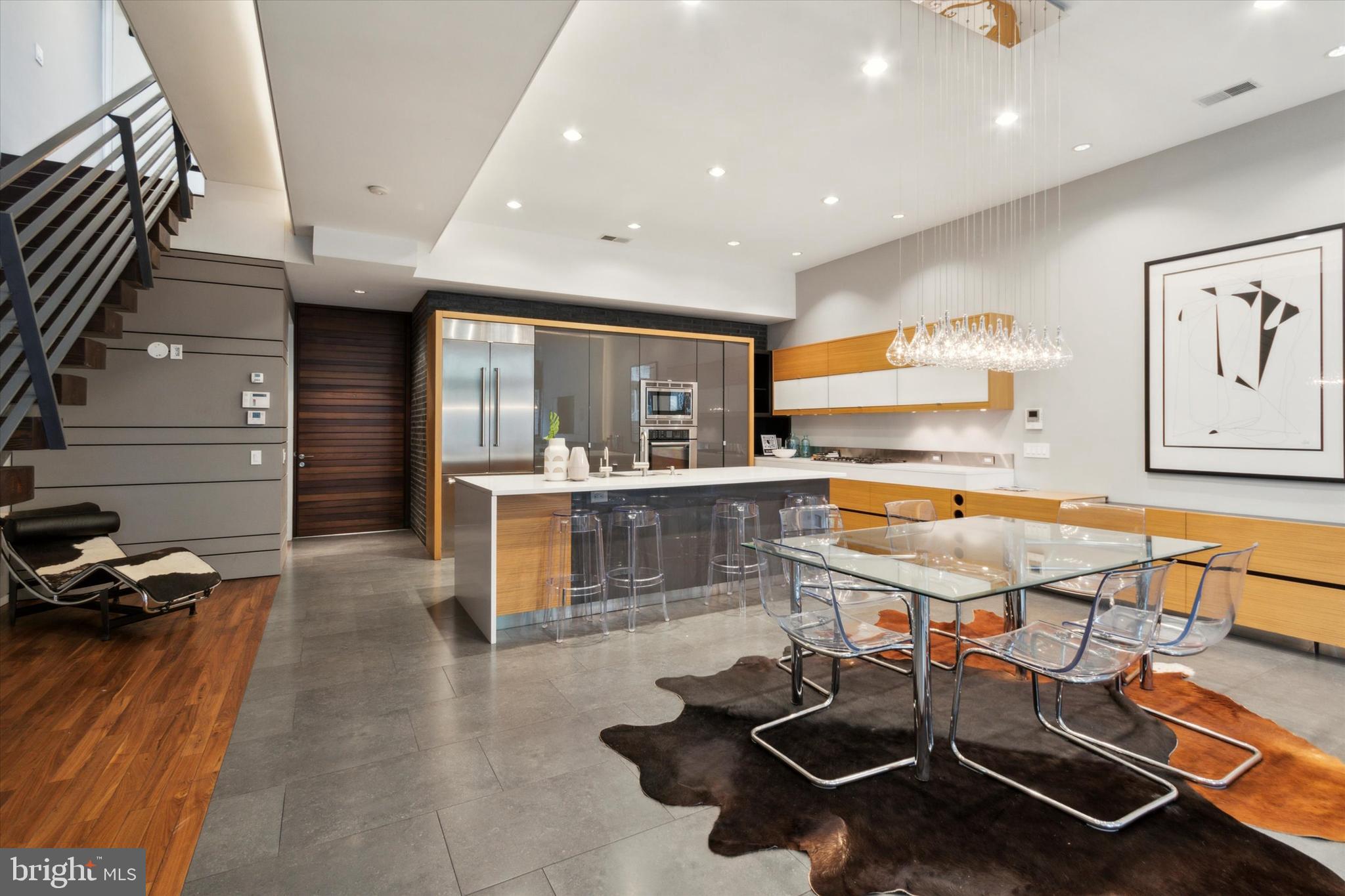 1012 N 3rd is the perfect home for the discerning buyer. At a remarkable 26 feet wide, this architecturally significant 6 bed, 6 bath property features unique details, meticulously selected finishes, and thoughtfully designed spaces that create a seamless flow for everyday living — and a second living space with private entrance sets up the perfect environment for multigenerational living or an au pair suite. The main living space, perfect for entertaining and customized with heated floors, welcomes you into the home and features a full kitchen and dining space as well as a living area flanked by floor-to-ceiling windows that open out onto a deck and garden. On the next level, the atrium's soaring ceilings are complimented by a staircase that adds visual interest and texture to the space. Oversized bedrooms throughout the home feature abundant storage, and a second full kitchen continues the theme of spaciousness with an airy layout that flows directly into a dining space. Off the third floor, an oversized deck with the comforts of an outdoor living room combines the best features of both a roof deck and a balcony. The attached garage, which has been securely keyed separately from the home, means you're never circling for a parking spot. Conveniently located near Liberty Lands, gyms, restaurants, shops and more, this home is designed to allow you to take advantage of all the greatest parts of city living.