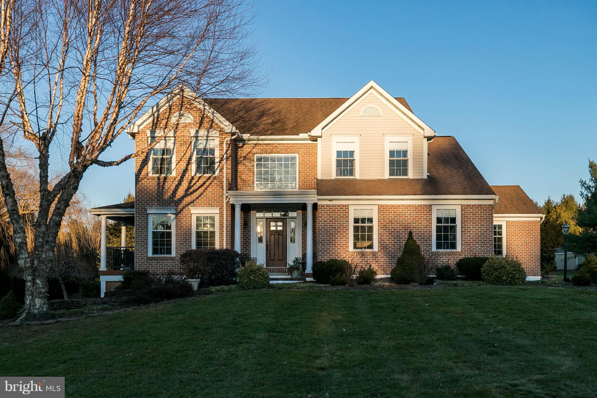 Beautiful 5 BR, 3.5 BTH Brick Front Colonial nestled on a Private 1.6 Acre Lot in the desirable Marshall Creek Farm community! The sellers have invested over $270,000 in additions and upgrades since first building this lovely Berks Builder's home, making it a place you will not want to miss seeing. Some of the many improvements include a fabulous Sunroom addition, finished Lower Level with Bedroom & Full Bath, 25 x 8 Covered Porch, brand new Master Bathroom, state of the art Geothermal heating system, Generator, Deck and 2 Patios. This home truly blends comfortable family living spaces with wonderful indoor and outdoor entertaining areas. A pillared front entry with new front door leads into the main level, highlighted by a private Study with built-ins, elegant Living Room, Dining Room with hardwood floors, moldings and access to the inviting Covered Porch and remodeled Powder Room. A convenient Drop Zone was created by adding custom built-in cabinetry with storage benches just off the kitchen and garage. As you walk into the Kitchen you will know that you are at the heart of the home. The Kitchen with granite countertops and island overlooks the Morning Room with sunny Palladium window. This is a great spot to sit back and enjoy views of the private rear yard. Off the kitchen is the 19 x 14 Sunroom addition with an attractive wood plank ceiling that complements the Chester County stone fireplace, dry bar and pantry closet along with an exit to the paver patio with accent ledge with lighting and 280 sf deck. Adjoining this room is the cozy Family Room with coffered ceiling and brick propane fireplace, offering just the right amount of separation from the sunroom.  The 3rd garage bay was converted into an attached storage shed, accessed at the rear of the home. This space makes it very handy for yard tools, storage of outdoor furniture, bikes, sports equipment, etc, while the 2 car garage gives you plenty of room to park your vehicles. Upstairs you will find a refined Master Suite complete with vaulted ceiling with fan, two walk-in closets with custom shelving and newly remodeled Bath with vaulted ceiling, granite double bowl vanity and pebble floor shower. Three additional Bedrooms, an updated Hall bath, and convenient Laundry Room complete the 2nd floor. The Walk-out Lower Level offers a large Recreation Room with brick accent wall and access to the backyard, plus a Bonus/5th Bedroom, Full Bath, and Storage Area. This space would be perfect for in-law quarters, guests, exercise or craft room or 2nd office area. The backyard is truly designed for personal enjoyment - whether you are entertaining on the large back deck, side porch or paver patios, relaxing in the hot tub or playing games on the expansive, manicured lawn. Other updates/amenities include landscaping, replacement garage doors, interior hardware, wiring for sound in KIT, LR & FR, security system and storage area under porch. Septic system has been inspected and certified, giving you peace of mind. Ideally located in the Award Winning Downingtown Schools, home of the STEM Academy, with Brandywine Wallace Elementary just a short drive away. Enjoy the space and privacy that this home offers, while being within a very easy commute to major routes, local shopping and dining and within a few minutes to Marsh Creek State Park. This popular Park offers boating, fishing, water sports, walking trails, horseback riding and picnic areas. This home shows true pride of ownership!