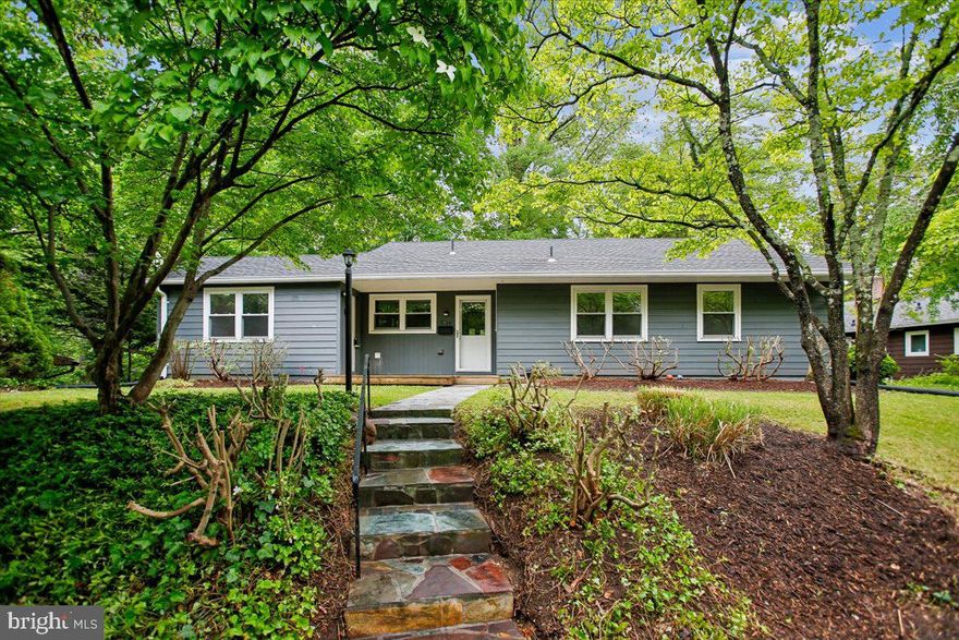 Mid-Century Modern charm in the heart of Bannockburn—with a remarkable history! This original gem was owned by one of the founders of Bannockburn, adding a special touch of legacy to its already unique appeal. Perfectly situated near the Bannockburn pool and clubhouse, the home offers breathtaking wooded views that create the feeling of a private retreat. Whether you’re ready to move right in, renovate, or build your dream home, this expansive 11,600 sq. ft. lot offers endless possibilities.

Step onto the inviting flagstone walkway leading to the front porch, where warm wood accents set the tone. Inside, the main living area features a cozy wood-burning fireplace framed by exposed brick, a stunning wall of windows, and a convenient access door that connects seamlessly to the serene backyard. The kitchen, complete with a practical laundry area, is ready to meet all your needs.

With three spacious bedrooms plus a 4th bedroom/bonus room, two full baths, and a rear deck perfect for relaxing or entertaining, this home truly checks all the boxes. Plus, the location couldn’t be more ideal—just minutes from the C&O Canal, Glen Echo, and a variety of shops and restaurants, with easy access to downtown DC and major commuter routes.

Don’t miss this rare opportunity to own a true Mid-Century treasure with a piece of Bannockburn history in a prime location!