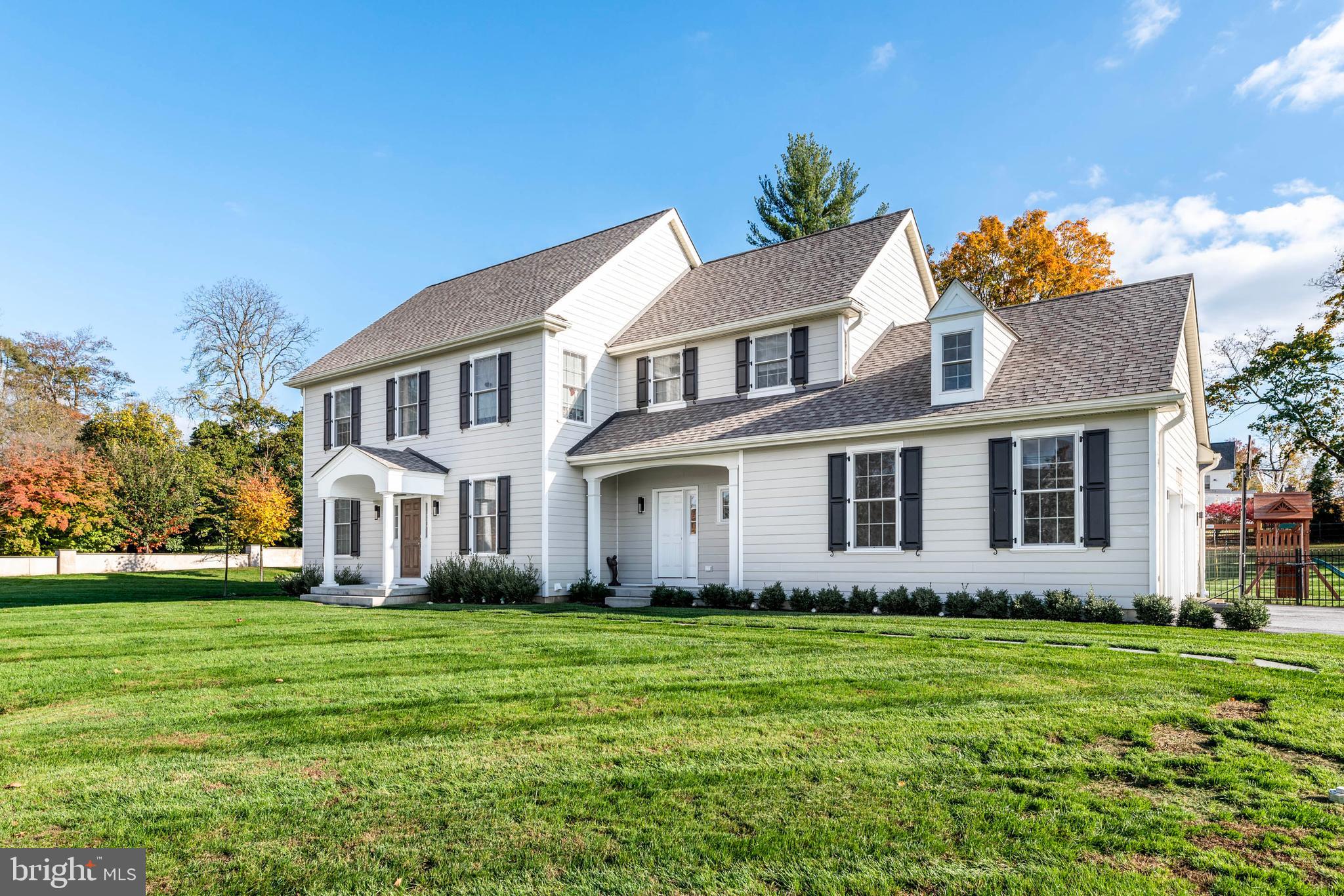 Welcome to this move-in ready home located in Ashwood Hall, designed by McIntyre Capron with easy exterior maintenance courtesy of James Hardie Siding and built by Bentley Homes in 2018. Well situated in the prestigious Devon Estate neighborhood, and within easy walking distance of the popular shopping in Devon Yard, this home also is within the noted Tredyffrin-Easttown School District. The lovely area, with its quiet streets and variety of pretty homes, encourages leisurely walks or energetic jogs. This beautiful and sunny home, set on a large, level lot, has wonderful curb appeal. The long private driveway flanks an expansive front lawn and walkway to the front door. There is an additional front entrance through the mudroom with laundry. Once inside, a neutral palette allows for your own special touch. The arched doorway is flanked by a living room and a formal dining room. The distinctive, 2-story open-concept family room with abundant natural light, fireplace, and wood floors is open to the white and bright kitchen with stainless steel appliances and center island. Pocket doors lead to the sunroom/bonus room, which was added to the original structure. A private study and powder room complete the main floor. Stairs from the foyer lead to the spacious second level. The main bedroom suite is luxurious, featuring two oversized walk-in closets and an en-suite main bathroom with double vanity sink, soaking tub, and glass-enclosed shower. Bedrooms two and three share a full bathroom, while the fourth bedroom features a private en-suite bathroom. The lower level is finished and adds even more living space. There is plenty of room for recreation or a home office, and a convenient half bath also is on this level. The surroundings are peaceful and bucolic, with a level lot both fronting the home and in the rear. An attached two-car garage offers additional storage space. The bucolic serenity of the Main Line meets convenient access to shopping, dining, golf clubs, and all that the nearby towns of Wayne, Berwyn, and Paoli have to offer. With an excellent school district and within an easy stroll to Devon Yard and its wonderful stores and boutiques, including Anthropologie and Terrain Gardens, this Berkley Road location has phenomenal appeal. There is also easy access to the Devon train station and Whole Foods.
