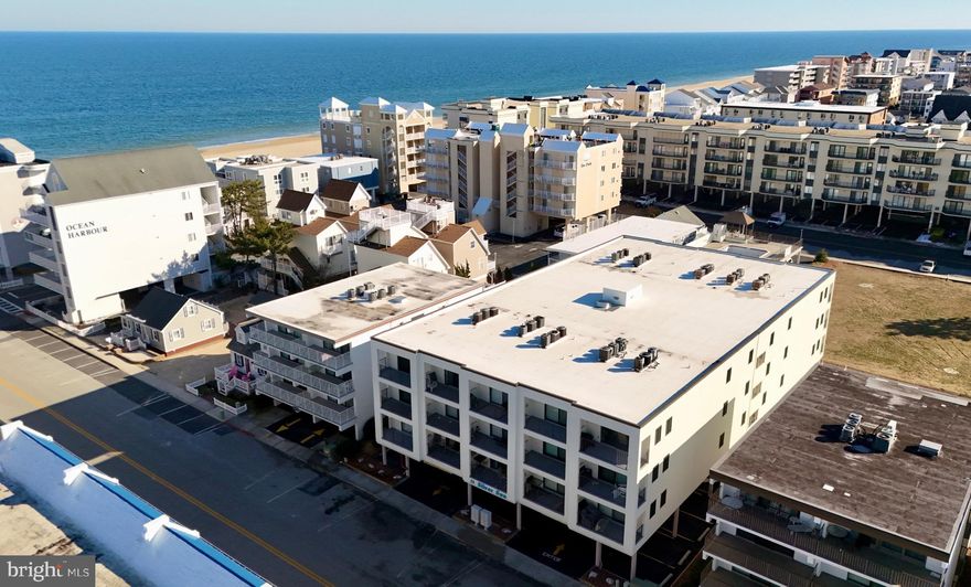Welcome to your bright and cheery north Ocean City retreat, perfectly situated on the ocean block, 1 block from the beach! Located in the desirable Silver Sun building, this 2-bedroom, 2-bath condo offers a the coastal lifestyle with a host of amenities. Enjoy a refreshing dip in the outdoor pool, take advantage of the convenience of an elevator, and keep all your beach essentials in your private storage locker. The unit also includes an assigned parking space, with additional parking available under the pool and plenty of public parking right in front of the building.  Inside, the inviting floor plan features a spacious living area with space for a dining table, and glass sliding doors leading to your private balcony—ideal for soaking in the coastal breeze. The kitchen shines with white cabinetry, beautiful granite countertops, a stylish breakfast bar with pendant lighting, and newer appliances. The primary suite boasts an ensuite bath, while the full hall bath has been updated with a sleek stall shower.  Perfectly located near the MD/DE line, this condo offers easy access to Ocean City’s vibrant restaurants, shopping, and entertainment. Whether you're searching for the perfect beach getaway or a smart investment opportunity, 11 143rd Street #108 is a must-see!