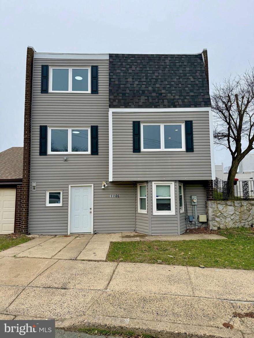 Come and check out this fully renovated 4-bedroom 2 full bathroom and 2 half bath Twin with tons of space. The Property is located on a well-kept block in the desirable Millbrook neighborhood in the Far Northeast. The home has new vinyl waterproof flooring throughout and the entire interior was freshly painted. There is also recessed lighting in the living room, dining room, kitchen and the finished basement. The kitchen is completely brand new, with white shaker cabinets on top and metro cool grey cabinets on the bottom. We added a pop of color with gold hardware, stainless steel appliances and a herringbone backsplash and quartz countertops. The Master Suite has two large closets, a feature wall and a gorgeous master bath with a timeless subway tile with dark grey grout to make it pop. The main hallway bath is very spacious with a new cool grey vanity with black hardware and ceramic tile faux marble bathtub.  On the main level there is a brand-new half bath and a 4th bedroom. The finished basement has 2 large rooms and a laundry room with a half bath. The property also features a large composite trek deck and a spacious fenced in yard. Central Air, Forced Heat, Garbage Disposal, Soap Dispenser, Dish Washer, Fridge with water and Ice, 4 total Bathrooms, recessed lights, driveway, garage, fenced in yard, deck, light features in all bedrooms, new carpet on steps and hallway, new vanities, and quartz countertops.