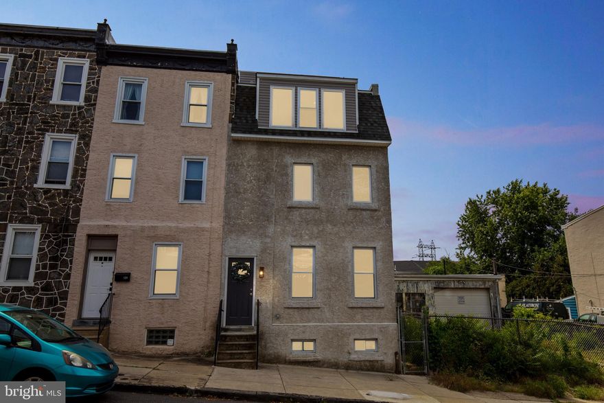 Your Search is Over! This is the one you have been waiting for. Welcome to 127 Vassar st, A Completely Redone from Top to Bottom, 3 Bedroom 3 bath house in a Great Location.  Enter in through the main entrance and you will see the modern yet cozy finishes. Brand new LVP flooring throughout, Brand New Kitchen with all new appliances Stunning quartz counters and Island for all your future entertaining needs. Beautiful exposed brick rounds out the living room and makes the space perfect for relaxing with friends and family. Out past the kitchen you have a half bathroom for convenience, and also a rear exit to your patio where you can set up tables and chairs for entertaining guests. Head up to the 2nd level to find 2 spacious bedroom's and a lovely Full bathroom equipped with a tub and beautiful tile surround. Also on this level is the laundry room, all set up for you. Continue up to the 3rd level and you find the very spacious Primary Bedroom, walk in closet, and the stunning Primary bathroom equipped with a large walk in shower and double vanity. This 3rd floor is dedicated to the owner of this lovely property. Also you gain access to the roof top deck from this level! Just imagine waking up and enjoying a cup of coffee, tea or beverage of choice while you soak in the morning sun overlooking the city scape! This property is unique, nicely finished, and ready for you to move in.  Conveniently located close to major highway systems, yet still has the neighborhood feel with local cafe's and bars within walking distance. Also less than 5 min from Main st Manayunk. Make your appointment to see now.