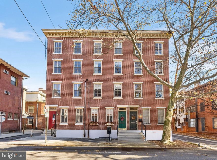 Welcome to 411 S 18th Street. Nestled just blocks away from Rittenhouse Square, this home is tucked between the charming, tree-lined streets of Addison and Waverly. With 3 bedrooms, 2.5 bathrooms, 2 outdoor spaces, and a finished lower level, this home combines modern living with classic Philadelphia charm. Upon entering, you’re greeted by a sun-filled entertainment room with soaring ceilings and hardwood floors throughout. A stylish wet bar sets the tone for gatherings, while large windows allow natural light to flood the space. The second floor features a spacious and well-appointed kitchen, complete with a large island, granite countertops, and a built-in window banquette with storage. A perfect spot to enjoy meals, it seamlessly connects to a private deck—ideal for outdoor dining or relaxing. This level also offers a convenient half bath. The third floor is home to the master suite offering plenty of natural light, custom plantation shutters, and a plenty of closet space. The top floor includes two additional light-filled bedrooms, the front one with plantation shutters, one with a skylight and there is another another full bathroom on this floor
The finished lower level provides extra storage and a laundry area. There are also street access via Bilco doors for added convenience. Walk to work, dine at the city’s finest restaurants, and explore the best shopping and parks—all just moments from your front door. The location offers the ultimate urban living experience.