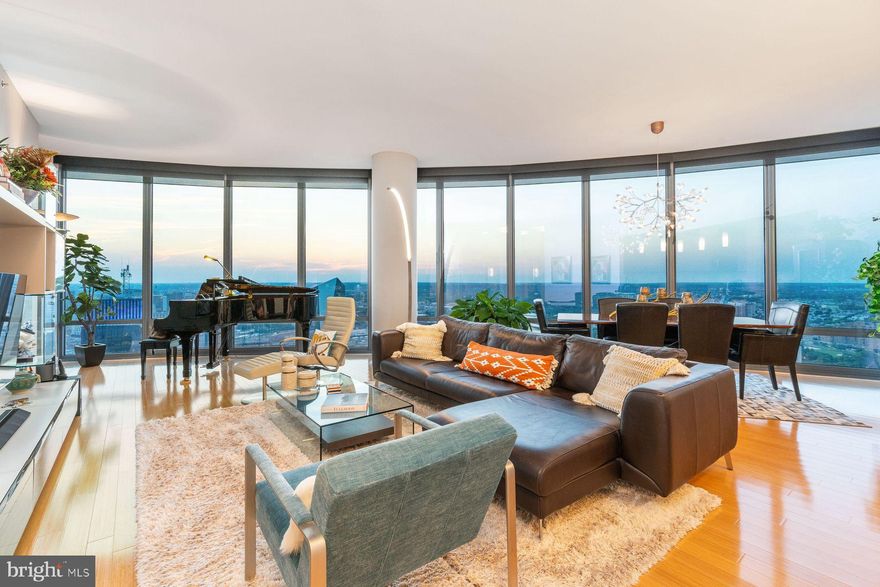 Welcome to The Murano Unit 4202, a rarely available 2-bedroom, 2.5-bathroom Center City penthouse. This home offers an unparalleled city living experience. Upon entering this sky-high home, you will be mesmerized by breathtaking, unobstructed views of such famous landmarks as the Philadelphia Art Museum, Boathouse Row, and the iconic 30th Street Station. The large, open-concept Great Room features floor-to-ceiling windows and connects seamlessly with the formal dining room and large kitchen creating an ideal space for relaxation and entertainment. It also opens to a west facing outdoor terrace where you can relax and enjoy the city views and unforgettable sunsets. Two large bedrooms, each with ensuite bathrooms, complete the living space.  Other notable features of this home include custom closets, automatic solar shades, 3 zone HVAC, and plenty of storage space including an oversized, climate-controlled indoor storage locker. The Murano also features a host of amenities including a large fitness center, indoor pool, community room, and a large outdoor sun deck.  Concierge/security service is present 24/7, and there is the also the added convenience of self-parking in your two deeded, premium parking spaces in the attached private Murano parking garage (with secure indoor elevator access from the main lobby).  The Murano is located in the vibrant and rapidly developing West Rittenhouse neighborhood. Enjoy easy access to cultural landmarks, a bustling nightlife, and many fine restaurants, or walk minutes to 30th Street Station and catch a 70-minute Amtrak train to NYC.  It is literally steps away from Trader Joe’s and a short walk to Giant and Whole Foods grocery stores.
Indulge in the ultimate urban lifestyle with the perfect blend of luxury, comfort and convenience in this exquisite penthouse.