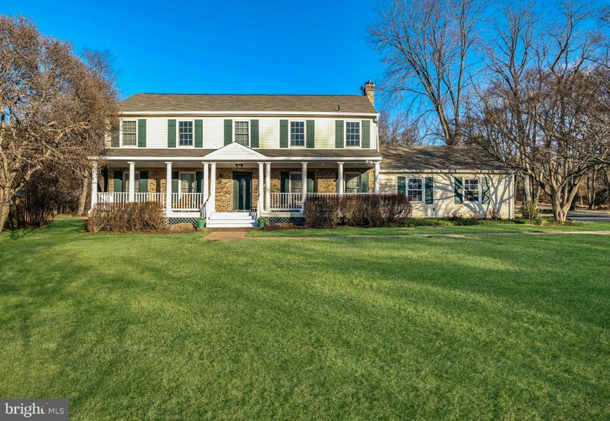 Nestled along a winding country road and set back on a picturesque rolling lawn, this classic brick and siding colonial, almost 4,000 SF, with a welcoming front porch exudes timeless charm.  Upon entering the front-to-back foyer you are greeted by the Formal Dining Room to the left and the inviting Family Room with a wood burning fireplace to the right, featuring custom built-ins and glass French doors leading to a tranquil sunroom, complete with recessed lighting, a ceiling fan and a gas fireplace.  The fully renovated Chef’s Kitchen with high end, two-tone cabinets, custom beveled granite countertops, gorgeous pendant lighting, stainless steel appliances including two dishwashers and an ice maker along with a large center island offer everything one could desire.  Adjacent to the Kitchen is the Breakfast Room with recessed lighting and sliding glass doors to the expansive rear deck-perfect for outdoor gatherings.  Upstairs, the generously proportioned Primary Suite boasts an updated en suite full Bathroom and walk-in closet. Three additional large bedrooms and two full bathrooms complete the upper level. The finished Lower Level offers a spacious Recreation Room with a game area plus a sitting area along with ample unfinished storage space. Outside, the beautifully level front and rear lawns, just over an acre, provide ideal spaces for children, pets, outdoor entertaining and gardening.  Start planning your summer parties and get ready to make unforgettable memories.   Your friends and family won't want to leave this beautiful home and amazing setting.   Perfectly positioned within easy access of the Shady Grove Metro, I-270, the BioMed Corridor; Shady Grove Hospital, great local dining and shopping at Falls Grove and Traville Gateway, this home can't be beat.  This exceptional property offers everything you need to create the perfect home!  Don't miss it!  Wootton School Cluster