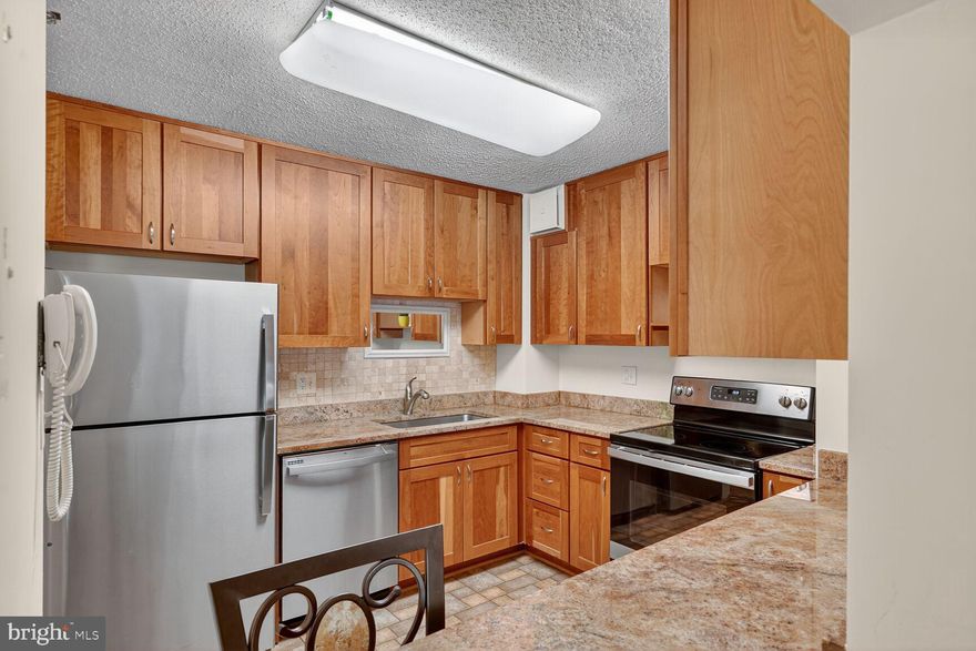 Welcome to Leisure World! A beautiful 55+ community offering resort-style amenities and a low-maintenance lifestyle.

This spacious condo features an updated kitchen with stainless steel appliances, granite countertops, and modern maple cabinets. Both full bathrooms have been tastefully renovated with contemporary finishes and a convenient walk-in shower.  Air-handling system with humidifier and electronic filter for allergens. 

The open living and dining area provides the perfect space for entertaining or everyday comfort. Each bedroom includes two closets and an ensuite bathroom, double pane windows, while the in-unit washer and dryer add everyday convenience.

One of this unit’s standout features is the sunroom plus patio—a rare perk available only in first-floor units! These spaces are ideal for relaxing, reading a book, or enjoying the peaceful, green views.

Additional highlights include a private parking space and extra storage - #41 and golf cart space G-6.

At Leisure World, residents enjoy a wealth of amenities, including a golf course, tennis and pickleball courts, indoor and outdoor pools, fitness centers, recreation and game rooms, walking trails, and so much more. 

Bi-annual HVAC checkup included in condo budget. All sunroom/patio furniture conveys, and drapes. The owner is responsible for electrical power used for heating, cooling, electrical devices and cooking. 

Come experience the charm and comfort of Leisure World—schedule your tour today!