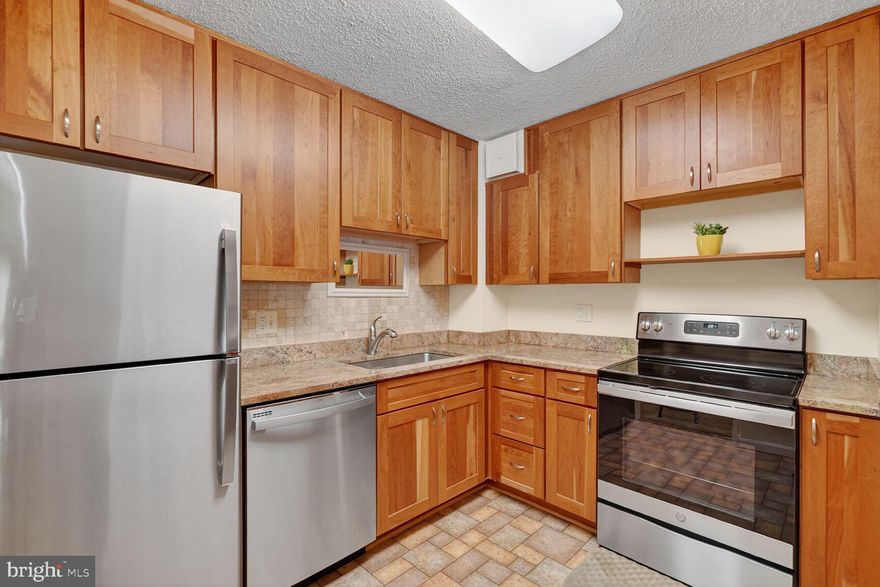 Welcome to Leisure World! A beautiful 55+ community offering resort-style amenities and a low-maintenance lifestyle.

This spacious condo features an updated kitchen with stainless steel appliances, granite countertops, and modern maple cabinets. Both full bathrooms have been tastefully renovated with contemporary finishes and a convenient walk-in shower.  Air-handling system with humidifier and electronic filter for allergens. 

The open living and dining area provides the perfect space for entertaining or everyday comfort. Each bedroom includes two closets and an ensuite bathroom, double pane windows, while the in-unit washer and dryer add everyday convenience.

One of this unit’s standout features is the sunroom plus patio—a rare perk available only in first-floor units! These spaces are ideal for relaxing, reading a book, or enjoying the peaceful, green views.

Additional highlights include a private parking space and extra storage - #41 and golf cart space G-6.

At Leisure World, residents enjoy a wealth of amenities, including a golf course, tennis and pickleball courts, indoor and outdoor pools, fitness centers, recreation and game rooms, walking trails, and so much more. 

Bi-annual HVAC checkup included in condo budget. All sunroom/patio furniture conveys, and drapes. The owner is responsible for electrical power used for heating, cooling, electrical devices and cooking. 

Come experience the charm and comfort of Leisure World—schedule your tour today!