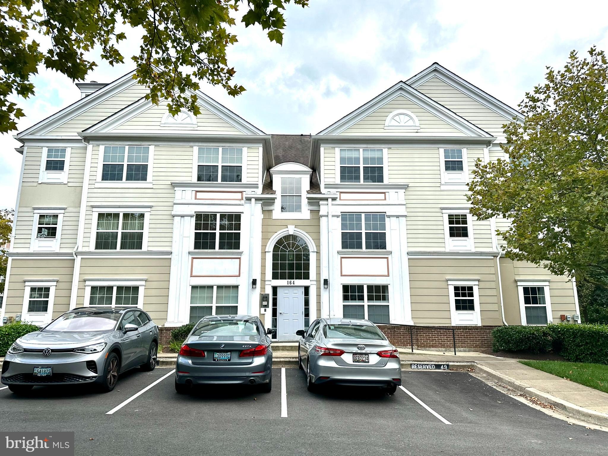 Welcome home to this spacious Penthouse in the Kentlands! Featuring bright, natural lighting, hardwood floors, and vaulted ceilings. Enter into the spacious living room, featuring a wood burning corner fireplace with hearth, and an extra wide sliding glass door leading to the balcony, the perfect place to enjoy a warm cup of coffee every morning! Enjoy family dinners in the dining room featuring hardwood floors and track lighting. Escape to the main bedroom suite that features plush carpeting, cooling ceiling fan, and a large walk in closet with custom, built in shelving! Also includes an in-suite bathroom with dual sink vanity and a soaking tub with shower combo. Enjoy easy access to the balcony from the additional balcony door in your bedroom. Take the stairs to the upper level loft with a balcony overlooking the main living area. Featuring plush carpeting, skylights, ceiling fan, and access to the washer and dryer, this is the perfect space for an additional living area or home office! The Kentlands offers many amenities including an outdoor pool, tennis courts, basketball courts, pickleball, gym, and a clubhouse! There is one assigned parking spot with the unit and plenty of visitor parking. Conveniently located near multiple shopping and dining destinations - do not miss this one!
