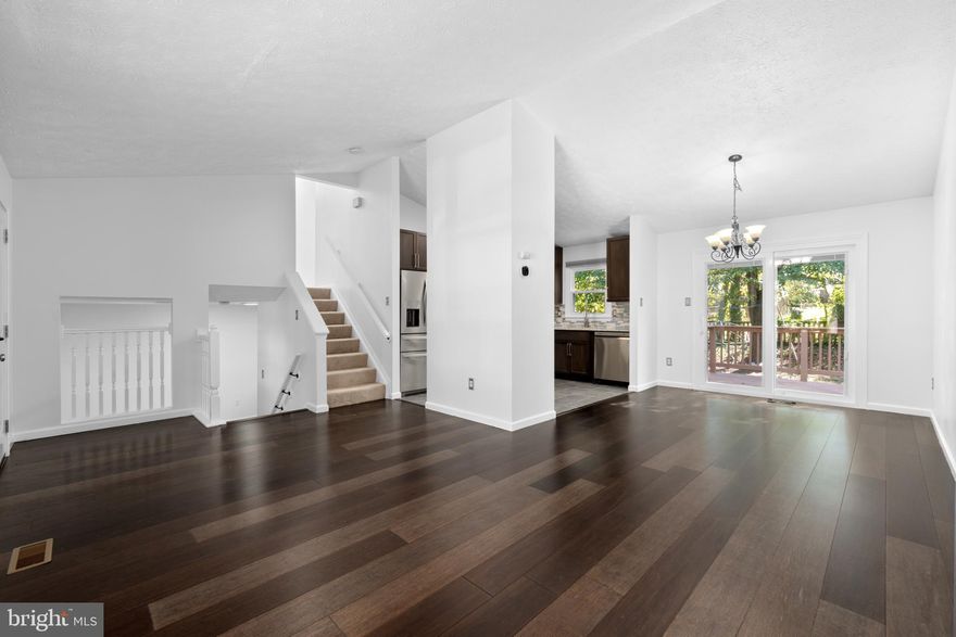 Welcome to one of the standouts in Kings Grant (North Laurel). This early-’90s split-level has the updates you want and the vibe you need. The kitchen was fully redone in 2021—stainless appliances, espresso cabinets, great prep space—so you’re set for weeknight meals and weekend hosting. The main level brings Kona bamboo flooring, the entire home is freshly painted, and the top level has brand-new carpet. In 2025, the windows were upgraded to Power Symphony-style and the exterior doors were replaced (hello, Pella entry door + smart lock) for comfort, style, and efficiency. Roof replaced in 2017 for extra peace of mind.
Upstairs, you’ll find three generous bedrooms—each with a ceiling fan—including a large owner’s suite with a spa-like 2023 bath. The lower level flexes for real life—game night, movie spot, or a WFH office—and there’s a huge unfinished basement waiting for your gym, workshop, or storage goals. Out back, the private, partially fenced yard and deck are made for grilling and get-togethers. Bonus: hot water heater 2021.
All in a prime Howard County location with quick access to major commuter routes, Fort Meade, shopping, and dining—plus it feeds into top-rated Howard County Public Schools (buyer to verify). Move-in ready and easy to love: style, function, and location—boxed and bowed.