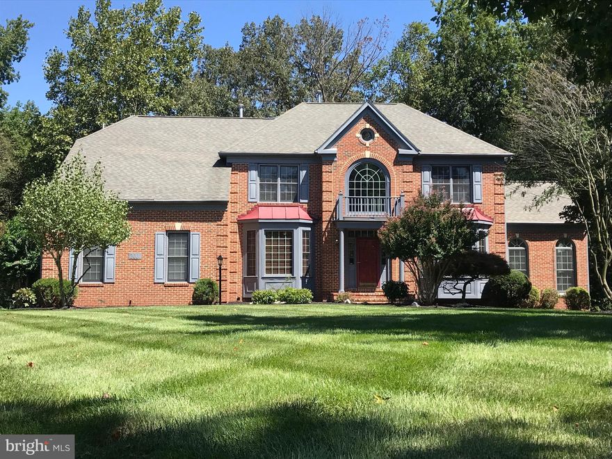 Stunning Estate Style Home in desired Woodmore South.  Shows like a model.  Thoughtful designer quality upgrades throughout.  This meticulously maintained home provides 5 bedrooms and 4 full baths spanning 3 three levels and over 5,500 square feet of finished living space.  Loaded with features, including open and soaring 2 story foyer, main level study, sunlight solarium with Pella high UV protected windows, stunning remodeled master bath retreat, ample kitchen with granite and stainless appliances, whole house generator (natural gas supply & auto transfer switch), newer architectural roof, finished and polished garage, upgraded 3.5 ton upper level AC, whole house water softener, and landscape lighting plus sprinkler system.  Home warranty included.  Exceptional offering not to be missed.