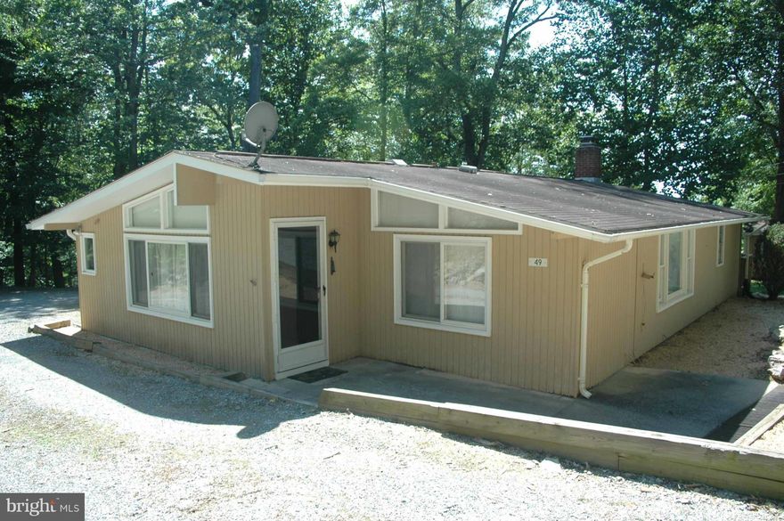 Great for first time home buyer or investment home. Great for commuters! Newly installed carpet, freshly painted, tiled bathrooms, brick fire place with insert, large deck with gates, .75 acre w/ fenced back yard with views of and access to the Shenandoah River. End of road privacy with storage shed in back. Property consist of Lots 114, 52, 53, 55.