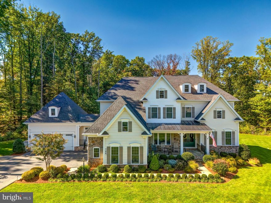 Truly one-of-a-kind. Step into timeless elegance and refined craftsmanship situated on over 2 acres - this picturesque and meticulously maintained lot offers the perfect balance of refined living and natural beauty.  From the moment you arrive, you'll be captivated by the home's elegant presence and the professionally designed landscape, hardscape, and landscape lighting that highlights its beauty well into the evening. A full irrigation system ensures lush greenery and pristine gardens year-round, enhancing the curb appeal and serenity for this home. 
A grand foyer entrance welcomes you into a home that perfectly blends classic luxury with modern convenience. Inside, enjoy soaring coffered ceilings, custom electric plantation shutters, and expansive living spaces flooded with natural light. With 5 bedrooms and 6.5 bathrooms across over 7,500 square feet, this home was thoughtfully designed for both comfort and sophistication. Each bedroom has it's own attached bathroom ensuite, plus an additional full bathroom in the walk-out basement. 
The heart of the home is the gourmet kitchen, which opens to a warm and inviting family room-ideal for everyday living or entertaining guests. Step outside to your personal sanctuary: a deck, custom-built patio featuring a striking stone fireplace and built-in seating, all beautifully framed by custom landscape lighting. Enjoy the privacy and serenity of your backyard enjoying wooded views.  
Retreat to a lavish primary suite offering a custom-built walk-in closet, and a spa-inspired bathroom with an oversized double-headed shower and soaking tub. Convenience abounds with laundry rooms on both the main and upper levels, as well as a spacious 4-car garage for all your storage and parking needs.
The finished lower level is a true showstopper, boasting a wet bar, home gym space, and a dedicated theater room, office/flex room, full bathroom, perfect for entertaining or relaxing in style. Plenty of storage space as well.  Located just minutes from Sugarloaf Mountain, scenic trails, top-rated schools, and commuter routes, this estate offers the perfect blend of privacy, luxury, and accessibility.

144 Greentree Farm Drive isn’t just a home—it’s a lifestyle. Come experience exceptional living in one of Montgomery County’s most tranquil and sought-after communities.