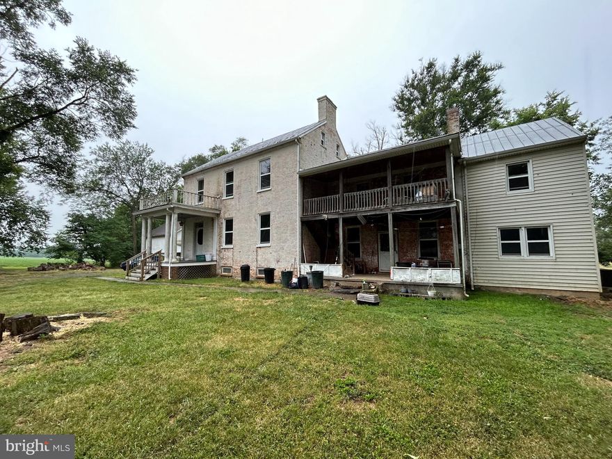 A remarkable opportunity to own a farm in Jefferson County.  This 3594 sq ft farmhouse sits on over 14 acres and is next to door to Jefferson County High School. Built in stages over the years.  The bones of this house are really good.  Sure, it needs some TLC but if you have vision, this place could be spectacular.  From the curved, 3 story staircase that sweeps elegantly from the foyer to the third floor, to the fireplaces, and porches, this home just needs to be brought back to life.  There are cats on the property and many used to live inside the house so it has a strong kitty odor.  The 2 story detached garage is in great shape and will serve a valuable purpose if you farm the property.  The tranquil vistas of the neighboring farms with cows and horses is incredible.  The far off view of the Shenandoah Valley mountain ridge materializes every day out of the morning mist.  The trees in the yard are hundreds of years old and stand guard on this pretty homestead.  Sold as-is, this farm is priced to reflect a huge discount in the market.  Buy it, dream it, build it. Make it yours...