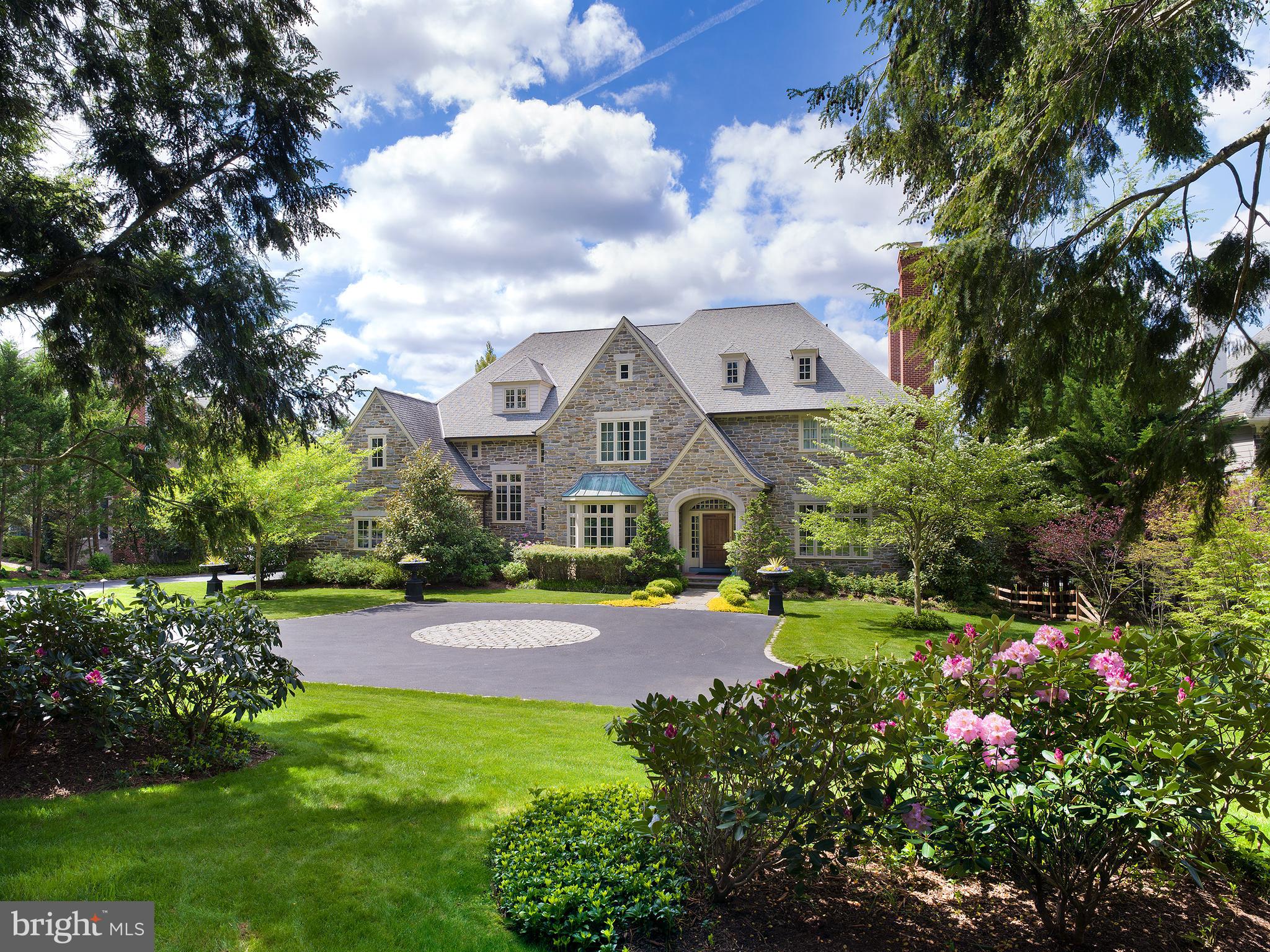 Move right into this stunning 5 bedroom, 5.2 bathroom European-style Colonial with an elegant stone facade, designed by esteemed architect Michael Visich and constructed by BJ Drueding Builders with the highest quality materials in the desirable Fenimore community of Gladwyne! This gracious 7,500+/- sq ft family home rests on pristine landscaped grounds marrying gorgeous open views. The park-like backyard connects to an adjoining 10-acre preservation area which affords privacy and is great for trail walking in the woods and outdoor recreation. A spacious rear bluestone patio with a built-in grill for entertaining overlooks the expansive picturesque yard where the kids and pets have plenty of room to play.
Inside, old world elegance blends with a spacious modern floor plan. The grand formal entry foyer is flanked by a fabulous living room with a fireplace to gather around and a regal dining room for hosting guests. Exquisite custom mill work, rich wood floors, substantial entrances and arches and a lovely main staircase enhance the sophistication.
The gourmet kitchen is in the heart of the house and a dream for the chef, family, and guests alike, with custom millwork cabinetry, a center island, limestone backsplash, and premium appliances including 2 full-size Sub-Zero refrigerators, a 48” Wolf range, steam oven and warming drawer. Adjacent to the kitchen is an open sun-filled breakfast area for sharing coffee and meals, and an inviting family room marked by striking vaulted beamed ceilings and a cozy fireplace. Also on the main level is a handsome office/study clad in woodwork with a fireplace and French doors, as well as a mudroom with built-in cubbies, a butler’s pantry, a workstation with built-in desk, and 2 powder rooms.
Upstairs an open landing awaits, leading to 5 generous bedrooms and 4 full baths. The
primary suite is truly impressive with its dramatic vaulted ceilings, marble fireplace,
huge walk-in closet and scenic nature views. The soothing spa bath with barrel vaulted ceiling presents dual vanities with limestone counters, a soaking tub and separate shower.
Adding to the allure are a full laundry room, a walkup attic, a finished day-lit
lower level with abundant rec space, gym and full bath. A new designer, infra-red “Yoga” sauna and wine cellar add to the multitude of amenities. The beautiful circular motor court fronting the home offers generous parking, and the driveway wraps around to an oversized 3-car attached garage with Tesla charging port.
Enjoy upscale living in this magnificent home nestled in the emerald tranquility of exclusive
Gladwyne Village, close to Rt. 76, shopping, dining, excellent Lower Merion schools, Center
City and all that the Main Line has to offer!
(*Real estate taxes are currently under appeal*)