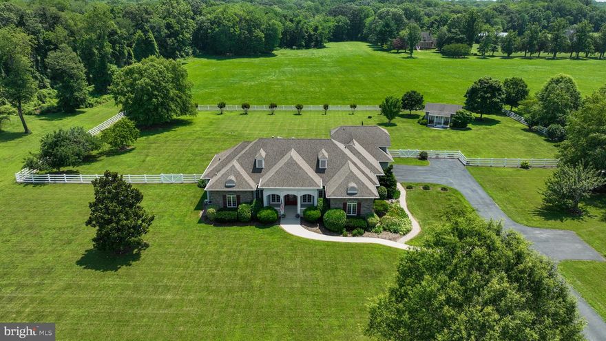 Incredible, polished to perfection, and loaded with all the upgrades —this Owings rambler with a finished basement is THE ONE! Situated on 3 meticulously maintained, usable acres in sought-after Calvert County, this over 3,200 sq ft home is a showstopper from the moment you arrive! Enjoy peaceful living with the most serene surroundings  just steps from the Patuxent River and the local pier—perfect for kayaking, paddle-boarding, or fishing.The curb appeal is next level with a stone exterior, extensive hardscaping, and a beautiful walkway leading to a charming covered front porch. Step inside to soaring 10 ft ceilings, a welcoming foyer, and an open floor plan filled with natural light. The great room features cherry hardwood floors, double crown molding, custom built-ins, and a double-sided fireplace that connects to the main level office. The great room also connect to the kitchen and a cozy sunroom/sitting area and has a door leading to a covered, screened-in deck with composite boards—ideal for relaxing or entertaining! The kitchen includes granite counters, stainless steel appliances, gas stove, island, additional prep sink, two pantries, recessed lighting, tons of cabinetry and overlooks the dining room with tray ceilings. Off the kitchen is a half bath, laundry, garage access, and stairs leading up to a private loft-style bedroom with full bath—ideal for guests or an in-law suite (bedroom #4). The main-level primary suite boasts two closets, access to the screened-in deck, and a spa-like bath with dual vanities, soaking tub, and walk-in shower with dual shower heads. Nicely sized bedrooms #2 and #3 share a full hall bath and both equipped with ceiling fans. Bring the party to the finished basement offering a rec room, storage, wet bar with mini fridge, and built-in surround sound.  Outside, the lot and fenced-in backyard is picture-perfect—complete with a patio off the deck, built-in fire pit, and a 14x28 shed that includes a climate-controlled workspace with heating and air, plus a separate section for lawn equipment with ramp access. Additional features include an oversized 2.5-car garage with a third bay for tools, equipment, or your boat storage, a full-house generator with WiFi and app monitoring, a built-in home audio system that connects through WiFi and a Sonos amp, and so much more. This home truly offers the perfect blend of comfort, function, and luxury—inside and out. Schedule your tour today!