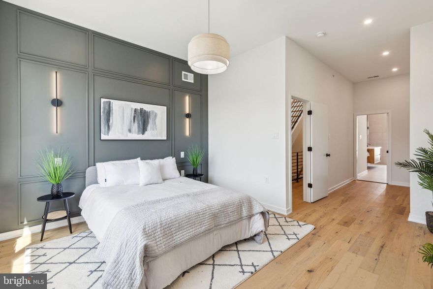 ***NOW OFFERING AN 18 MONTH BUILDER WARRANTY*** Welcome to 2147 Catharine Street, a stunning new construction home in the heart of Graduate Hospital! This home boasts 4 bedrooms, 3 bathrooms and 2,200 square feet of beautifully designed living space. Step inside and be greeted by an open concept living/dining area with beautiful 6 inch wide white engineered flooring, a floating staircase, and large windows allowing tons of natural light. The chef's kitchen features stainless steel Bertazzoni appliances, quartz countertops, pendant lighting fixtures, tons of white cabinetry, and a large island with room for barstool seating. Make your way through the sliding glass doors to find the first of your outdoor spaces that this home has to offer. This fenced-in backyard is perfect for entertaining guests & hosting dinners throughout the summer months. Upstairs, you’ll find 3 spacious bedrooms with ample closet space. The primary bedroom boasts a gorgeous accent wall and custom built-in closet as you make your way to the bathroom of your dreams! This an en-suite bathroom offers double vanity sinks, 2 shower heads, a stand alone tub, and floor to ceiling tiling. Pass by the wet bar as you make your way to the stunning rooftop deck with skyline views for the ultimate urban escape. Enjoy breathtaking sunsets or simply relish in the serenity of city living from your private oasis. The fully finished basement has a half bathroom and provides additional space for recreation, a home gym, home office, or a 4th bedroom. Situated in the heart of Graduate Hospital, you'll find yourself just a short walk away from neighborhood favorites Ultimo Coffee, Sidecar Bar & Grille, Loco Pez, and so much more! Schedule your showing today!