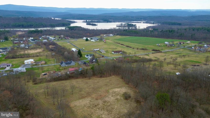 Beautiful building lot offering views of Shawnee Lake and the surrounding countryside. The 5.3+/- Acres offers open and wooded land, road frontage, and the availability to public sewer. This property would make a great location to build your dream home or getaway with Shawnee State Park a short distance away, offering hiking & biking trails, camping, swimming, & fishing.