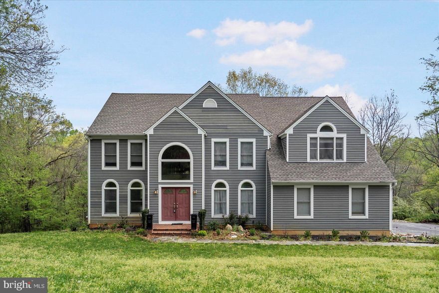 This four (4) bedroom, two-and-a-half (2.5) bath property was built in 1991, and the master bedroom/bathroom were renovated only a few years ago.  The palatial windows allow natural sunlight in every room of the house.  You open the double-front-door to a yawning foyer.  The first floor features a dining room, parlor, butler's pantry, half-bath (powder room), laundry room, mud room, and office.  Also on the first floor is a family room, with fireplace feature and vaulted ceilings.  Immediately adjacent is the kitchen, replete with island and double ovens.  From the kitchen, you can walk onto the enormous rear porch, which overlooks the property's more than six (6) acres of land, abutting a tributary of the Little Falls.

The upper floor features four bedrooms and two full bathrooms.  Included among those is the master suit, which comprises nearly one-half of the entre second floor, featuring a walk-in closet, two sitting areas, and a recently remodeled bathroom with a soaking tub, separate shower, and separate vanities.

The finished portion of the basement has wall-to-wall carpet and opens to the backyard.  The natural sunlight makes it the perfect den or family room.  The unfinished portion of the basement allows for ample storage.

The backyard features a second porch and a utility shed.  The two-car garage is attached to the property.