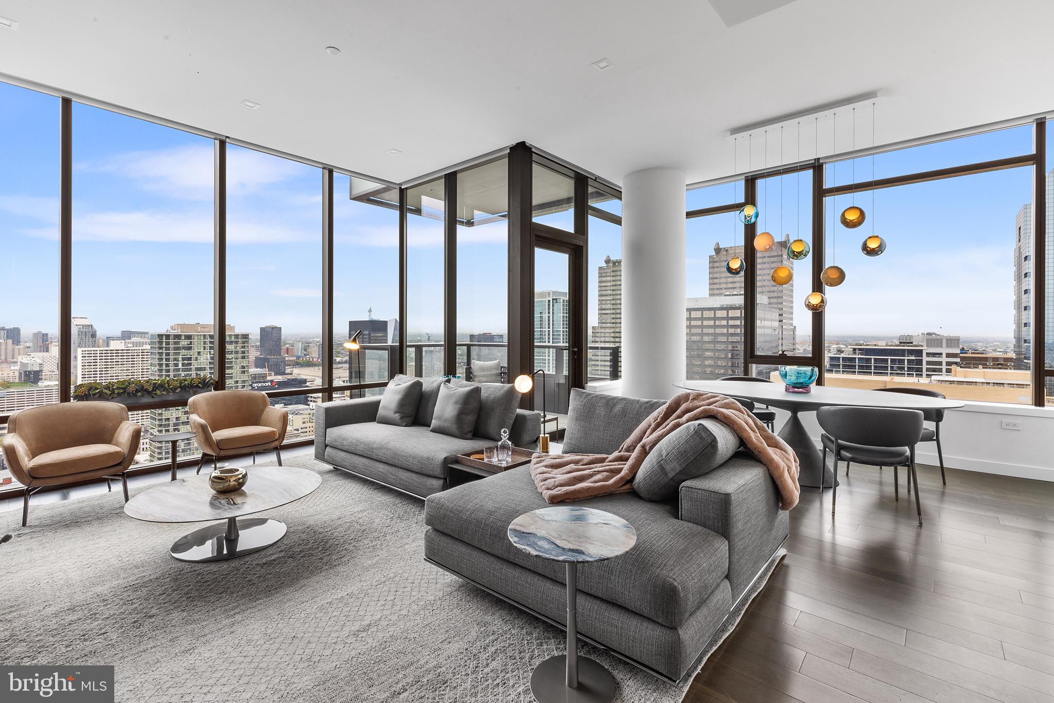 Introducing The Laurel, Philadelphia's newest luxury Condominium and the final residential opportunity on historic Rittenhouse Square. The striking glass tower soaring 48 stories is a masterpiece of contemporary architecture designed to inspire. The Laurel offers quarter floor Sky residences, half floor Estates and full-floor customizable Penthouses. Come home to one of the most spectacular sunsets the city can offer through the floor to ceiling windows. The corner balcony allows for a dynamic experience of views from north, west and south giving this home optimal light exposure. The Euro-style kitchen showcases a stunning high gloss Polar White cabinetry. Your chef will enjoy this state-of-the-art Sub-Zero and Wolf with an integrated refrigerator, gas cooktop, steam oven and full size convection oven. The kitchen island features White Statuary Quartz counters with waterfall edge, a large undermounted sink, Dornbracht faucet, Signature dishwasher and under-counter drawer microwave. Gorgeous 6” plank dark oak hardwood from Carlisle can be found throughout this home including the bedrooms. Homeowners will enjoy a spacious owner’s suite with two large walk-in closets, stunning sunset views and your own private spa-like oasis with luxurious freestanding soaking tub atop Empyrean Ice White marble floors surrounded by floor to ceiling porcelain walls and complimented by an expansive shower with Fantini shower fixtures. A comfortable size laundry room with full size Maytag washer and vented dryer make life easier. Prewiring for future blinds and smart home technology complete this magnificent residence.
***One parking space is included in listed price, second parking space is available for additional $100,000***