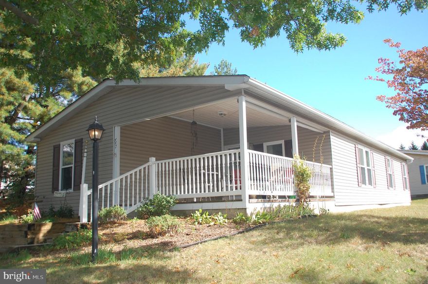 Very nice top of the cul-de-sac location on the outer rim of the very popular Hidden Springs 55+ community.  No through traffic here to be sure!  This Sherwood model has a  covered front porch (16' x 13'), one of the sought-after amenities at Hidden Springs.  Inside you will find the expected crown molding and cathedral ceilings, but no popcorn on the ceilings here!  This is a very clean and well-maintained home.  The roof is approximately 6 years old with gutter covers added on one side in 2022.  Year-round comfort is experienced through the Trane heat pump installed in 2020 while safety and convenience is provided by the low-threshold, walk-in shower installed in 2020.   Other improvements include: Shed (2024), GE smooth surface range (2021), GE refrigerator (2020), Whirlpool washer (2023) and GE dryer (2008),  Dual pane, insulated windows were added by a previous owner.  What's more, a pre-listing inspection was completed and is included with the Seller's Property Disclosure Statement.  Repairs made: crawl space wall, wires in crawl space elevated off floor, GFCI receptacle installed in Laundry Room, garbage disposal replaced, and screw replaced on tub handle so hot and cold water are working.  If you are looking for a home in Hidden Springs be sure to check out this excellent offering!