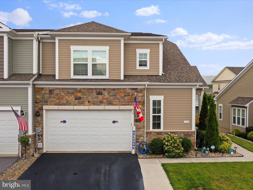 This spacious villa-style home featuring a main level master suite, sits the highly sought-after Martinsburg Station community. With three bedrooms and 2.5 bathrooms, it’s designed to offer comfort and convenience.
The home boasts elegant hardwood flooring throughout and a main level master suite for easy living. The kitchen is a chef’s dream with its granite countertops and large island, perfect for meal prep and entertaining. The living room features a modern electric fireplace and abundant natural light, leading to a deck with an awning for outdoor relaxation.
Upstairs, you’ll find a versatile loft area and two generously sized bedrooms, all serviced by a full bathroom. The unfinished basement is already framed and includes a rough-in for a full bath, offering plenty of potential for customization. This walk-out basement leads to a concrete patio, providing additional outdoor space. The property also includes an oversized garage and a spacious driveway.. The community amenities, including a pool, clubhouse, sidewalks, and tennis courts, enhance the living experience in this fantastic home.