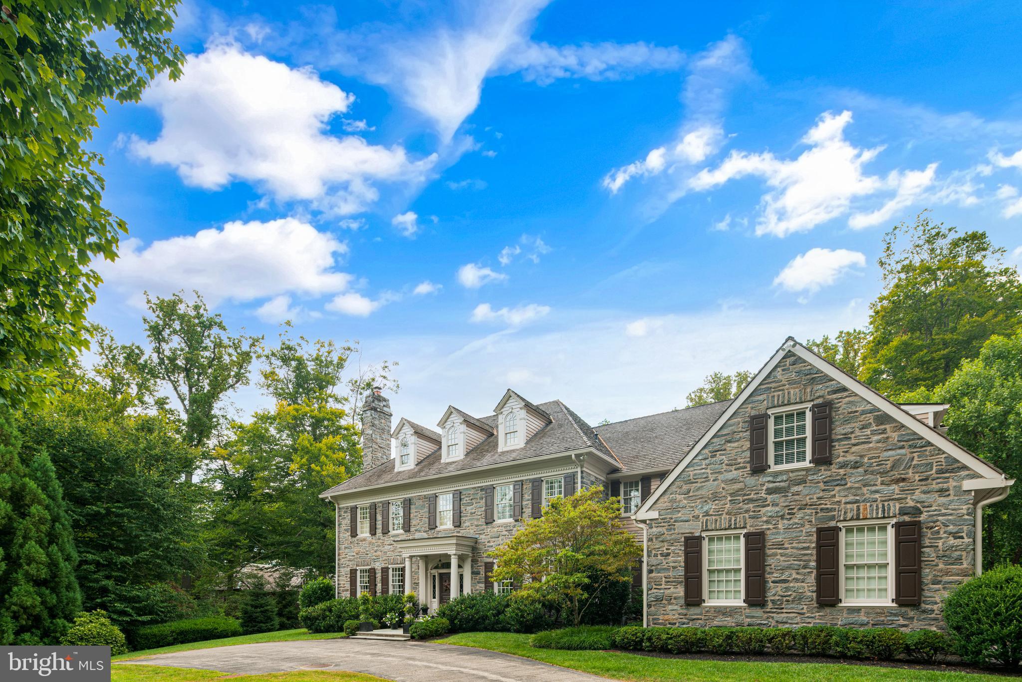 Situated on one of the most coveted Northside Main Line cul de sacs on 1.49 private acres on the former Austin Estate is this exceptional example of quality and understated elegance. Built by highly regarded Pinemar, Inc. with over 10,000 sq' of thoughtful and well designed space which allows for any decor from traditional to contemporary design. Stone and cedar exterior, beautiful millwork including extensive wainscoting, raised paneling, crown molding, sunlit rooms w/walls of transomed floor to ceiling south facing windows, oak flooring and three very spacious full levels of living space. Every amenity has been considered. 1st Floor: 10’ ceilings. Grand thru center hall, formal living room w/fireplace, banquet size formal dining room, gourmet kitchen w/oversized island, granite counters, 2 sub-zero refrigerators, Thermador 6 burner+ griddle cooktop, 2 Bosch dishwashers, 2 sinks, 2 Thermador wall ovens, a butler's pantry w/a copper sink, wine cooler and cabinets connecting to the dining room and a sunny breakfast room opening onto the spacious family room w/fireplace, built-ins, special box beamed ceiling and French doors to the bluestone patio and lush backyard with rolling lawns and mature landscaping. A stunning paneled library/office w/fireplace and a wall of bookcases, 2 powder rooms, mudroom with a sink, cabinetry, storage, garage access and a rear hallway w/backstairs and additional builtins and storage complete the main floor. 2nd Floor: 9’ ceilings. Huge main bedroom suite with a fireside sitting area, elegant dressing room, double walk-in closets, 2 marble vanities and a whirlpool tub plus separate marble bathrooms; 4 additional en suite bedrooms w/marble baths; There is also an open sitting/family/computer room w/built-ins, a large laundry room, linen pantry and backstairs. 3rd floor: a finished storage room and an expansive unfinished space plumbed for a future bathroom. Lower Level: Finished w/9’ ceilings: Family room, Full bath, additional rooms perfect for use as a gym, wine cellar, guest suite. Additional features include a generator, security and fire alarm systems, underground sprinkler system and so much more. Conveniently located near award winning schools, shopping, restaurants and the historic Rosemont train station as well as an easy trip to the airport or Center City Philadelphia. There is even a friendly neighborhood group with holiday and social activities and its own website with community news and updates.