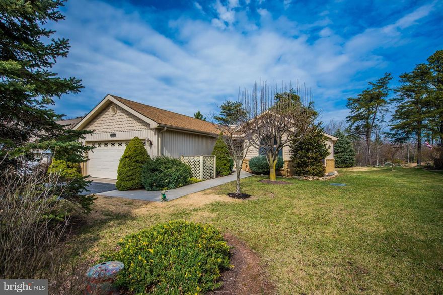 One level living w/ lots of natural light.  Vaulted ceilings, skylights, gas FP & triple sliding glass doors lead to an open deck w/ view of the 18th Fairway.  Remodeled kitchen w/ granite counter tops & wood floors+windows & doors replaced+new gas furnace installed 1/2017+shingles replaced 6 yrs. ago+8 x 16 screened deck w/ awnings.  Full golf membership available w/ $5350 initiation fee.