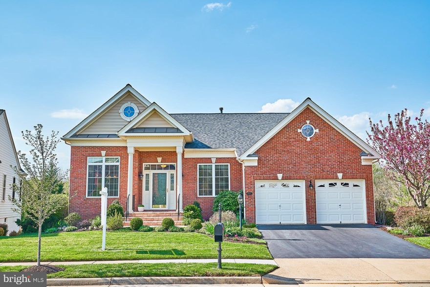 Absolutely  Immaculate Toll Brothers "Tradition" Model located in Regency at Dominion Valley Country Club.  Gorgeous setting backing to trees and woods.  Brick front, paver walkway and porch entice you inside.  Over 3,500 square feet of luxurious living.  French doors lead to the  main level office, and built in cabinets.  Formal living room with neutral paint and molding.  Full Bathroom adjoining 2nd Bedroom. Gourmet Kitchen offers the chef in the house silestone counters, new stainless steel appliances and gorgeous cabinets.  Breakfast Nook is perfect for dining and leads to the large screened in porch and trex deck.  Enjoy evenings sipping wine or coffee while your enjoy the serenity.   The view of trees and the lush landscaping is wonderful and private.  Large great room is perfect for entertaining or just relaxing .  The second bedroom is located on this level.  Primary suite has large walk in closet, extra room for all your bedroom furniture.  Bathroom is quite large with a soaking tub, shower and double vanities.   Lower Level is really spectacular with a wet bar, cabinets, and wood floors.  Owner has added an eat in area and custom bench.  A den could also be used a work out room or 3rd bedroom plus another area set up with a pool table and light.  Walk out to rear yard.  Utility room offers a work bench and lots of storage space.  Plus another storage room which could be converted to workout room.  A 3rd full bath completes this level.