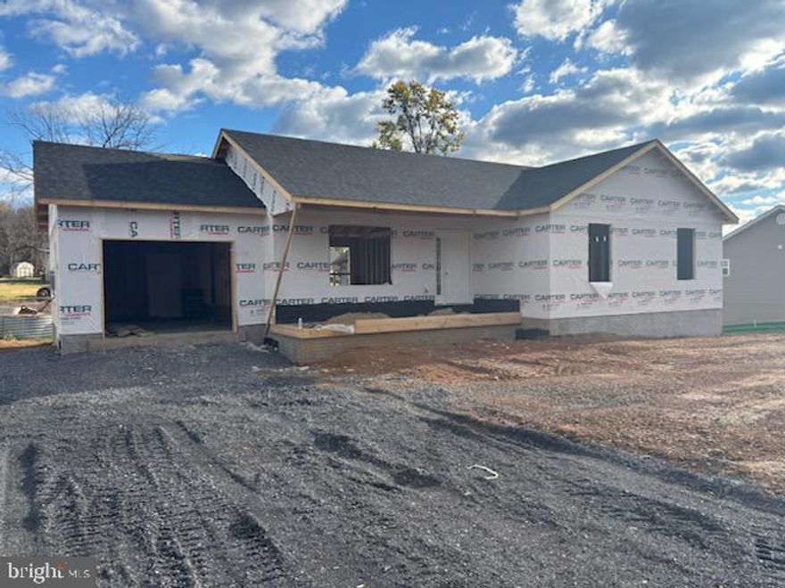 ✨ **New Construction Ranch – Last Ranch Lot in Subdivision!** ✨  This home is now under roof and will be ready for a end of March 2026 delivery.

Welcome to your brand-new one-level home, ideally located on a quiet, no-through street. Offering **1,305 sq. ft. of thoughtfully designed space**, this ranch features vaulted ceilings that seamlessly connect the living, dining, and kitchen areas with an airy open flow, complemented by a stylish ¾ wall for added definition.  Enjoy the outdoors on the charming front covered porch, ideal for morning coffee or evening gatherings

The **galley-style kitchen** includes a pantry for extra storage and adjoins the dining room, complete with patio doors ready for your future deck. **Luxury vinyl plank flooring runs throughout the main level**, bringing durability and modern style to every room.

The **primary suite** is a retreat of its own, featuring a spacious bath with a **double vanity**. and a walk-in closet.  Additional highlights include **two-tone paint throughout**, ensuring a warm, welcoming feel in every space.

Exterior features are low-maintenance with **vinyl siding**, plus a **concrete driveway** and a **1-car garage wired for an opener**. Peace of mind is included with a **1-year builder warranty per Virginia code**.

📌 **Key Features:**

* 1,305 sq. ft. on the main level
* Vaulted ceilings in living, dining & kitchen
* Galley kitchen with pantry
* Dining room with patio doors (deck-ready)
* Luxury vinyl plank flooring throughout
* Primary suite with double vanity
* Two-tone paint package
* Vinyl siding for low maintenance
* Concrete driveway & 1-car garage (wired for an opener) 
* 1-year builder warranty (per VA code)
* HOA is formed but not currently active
*Unfinished basement with Rough In for future bath
Finish as you wish! 

Don’t miss this opportunity to own the **last ranch lot available in this subdivision** – a rare find in today’s market!