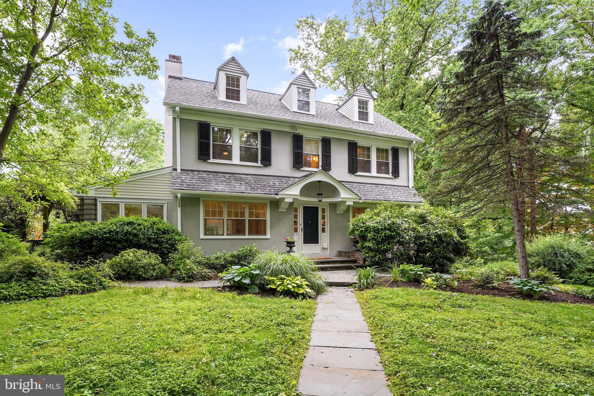 Spacious and beautifully appointed colonial now available in Swarthmore!  Just steps away from Swarthmore College and its amazing walking trails, this fabulous home offers lush landscaping, multiple outdoor areas for enjoyment and plenty of privacy in the award winning Wallingford-Swarthmore school district.   Enter the sun filled Center Hall with gorgeous hardwood floors and one is immediately struck by how open and spacious this home feels.  A formal Dining Room is on the right and a gorgeous Living Room on the left both with French Doors which are just some of the lovely architectural details that have been preserved in this home.  The house is a perfect blend of old and new as exemplified by the living room with built in bookshelves and a  fireplace which boasts a beautiful original mantle yet offers the convenience of being recently converted to gas.  The adjacent Sunroom is surrounded by windows and built-in shelving with a door to the patio and would be an amazing space for a playroom, home office or music studio. There is a glass-paned pocket door off the LR which leads to the huge Family Room that is filled with natural light from the many skylights and windows and has sliding doors overlooking the expansive flagstone patio and lovely backyard.  The family room opens up to the beautifully renovated gourmet Kitchen which features granite countertops, GE appliances, new Bosch dishwasher and many thoughtful appointments including a huge pantry with pull out shelves, display shelving, a wine fridge, extra stainless-steel sink and more.  The second floor is equally spacious and features a huge Main Bedroom with windows on three walls and ample closets, 2 additional Bedrooms and an updated Hall Bath with stone tile and glass shower.  The third floor has two additional Bedrooms, another Full Bath and a wall of built-in shelves.  The house also has many outdoor features including a two-car Garage with impressive work bench and additional shed for storage, a relaxation tub (or built-in sandbox), a charming Covered Porch and an enchanting Pergola with whimsical hanging lights on the ivy clad canopy which is made from reclaimed redwood.  The natural flow of this turn-key home is amazing and with dimmable recessed lighting, handsome hardwood floors, a new roof and access to the multiple outdoor sanctuaries at every turn, this house lends itself perfectly to both impressive entertaining as well as everyday family enjoyment…all in the desirable borough of Swarthmore.