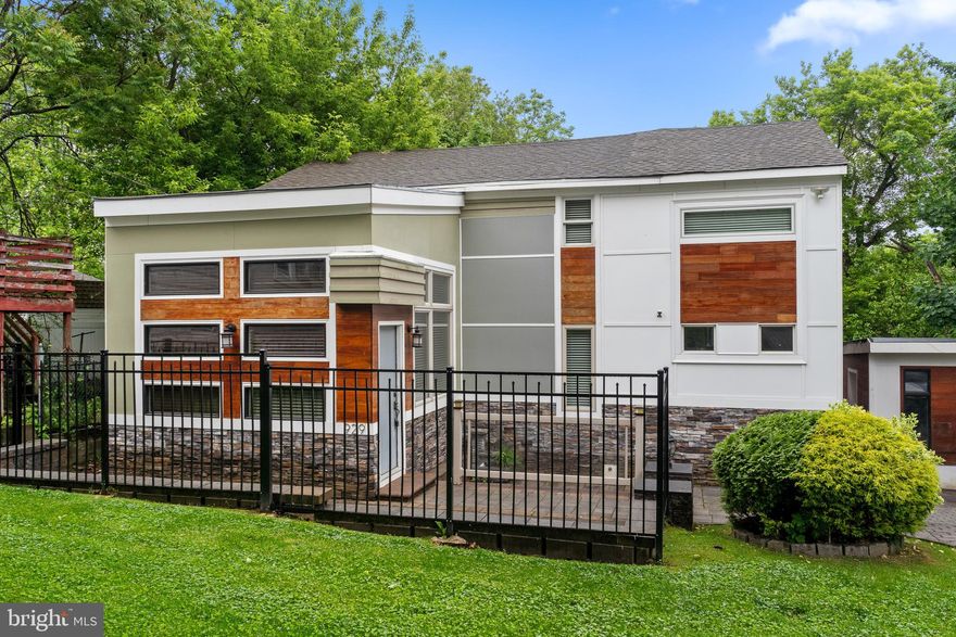 Welcome to 929 Sunset Street, an architectural masterpiece in the heart of Trainor Boro. This super contemporary home boasts an elegant iron fence and natural wood accents that frame the entryway, setting the tone for the sophistication within. A charming paver walkway and inviting front patio lead you into a residence defined by modern elegance and thoughtful design. Step inside to be greeted by rich hardwood flooring, fresh white paint, and neutral tone accent walls, creating a warm and welcoming ambiance. The built-in fireplace, with its striking stone surround and large focal mantle, serves as a beautiful centerpiece in the living area. Featuring contrasting cabinets, tile flooring, and top-of-the-line stainless steel appliances the kitchen is one you will enjoy spending time in. Granite countertops and a glass tile backsplash add a touch of luxury, while a full glass door opens to the rear deck, perfect for summer entertaining. The spacious family room is bathed in natural sunlight, enhanced by recessed lighting that highlights the room’s airy feel. This home offers four generously sized bedrooms, each with large closets and custom-built shelving, providing ample storage and organization. Both full bathrooms are adorned with extensive tile work, exuding a sense of luxury and spa-like tranquility. A glass surround staircase leads to the unfinished basement, offering potential for additional living space or storage. Outside, the large fenced-in backyard is ideal for gatherings, gardening, or simply enjoying the outdoors in privacy. Don’t miss the opportunity to own this exceptional home that perfectly blends contemporary style with functional living. Schedule your viewing today and experience the unparalleled beauty of 929 Sunset Street.