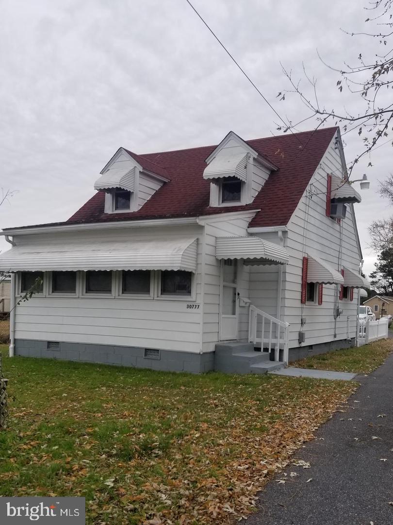 Lots of updates to this beautifully 2 story single family home, 3 bedrooms, a bedroom on the 1st floor, 1 bath in the town of Princess Anne. New kitchen with new cabinets, countertops, new appliances, new laminate flooring, in fact the entire home has new laminated flooring. Bathroom, with new fixtures, stall shower and new floor, new ceiling lights with fans throughout the home. This home has an enclosed front and back porch, for much comfort and relaxation. This home sits on a huge front and back yard, lot size about a 1/4 of acre. This property is an Estate Sale. Being Sold As Is. Don't let this one get away! Put this one on your next tour list. Vacant and Ready to go!! Agent has a financial interest in the property. SELLERS MOTIVATED.