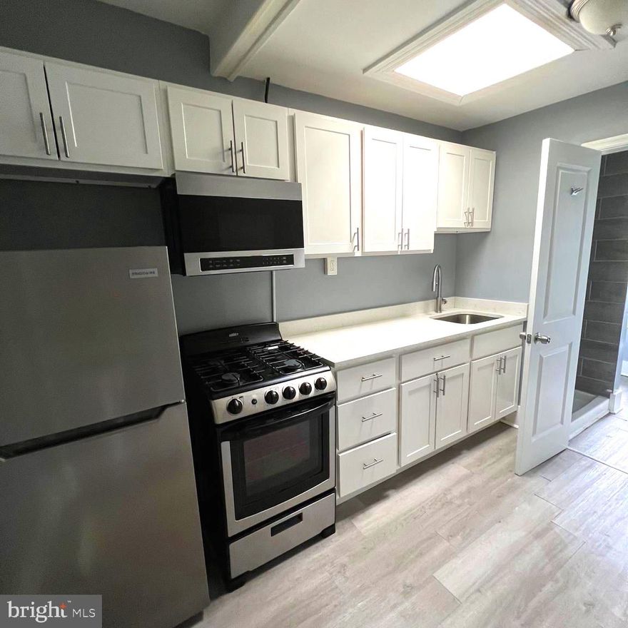 This spacious 2-bedroom, 1-bath unit sits on the third level and offers great separation and flow. One large bedroom is located in the front of the unit, and another is tucked away in the rear—ideal for roommates or anyone who wants added privacy.

In the center, you'll find a bright and open family/dining room, perfectly situated just off the kitchen. The kitchen is equipped with a gas stove, above-range microwave, and refrigerator, making meal prep easy and efficient. The bathroom includes a walk-in shower for a clean, modern touch.

Located in a classic Baltimore rowhome near the Union Square and Harlem Park areas, the property is close to public transportation, making commutes to downtown, university campuses, or the medical district a breeze. Grocery stores, corner shops, and local parks are all within reach, adding to the convenience of city living.

Whether you're a student, professional, or anyone looking for a comfortable place to call home, this unit offers both space and location that make everyday living easy.

Schedule your tour today.