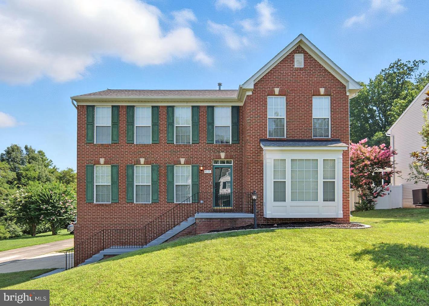 Beautiful and spacious, brick-front, 4-bedroom, 3.5-bathroom home with large fenced-in backyard located just a short commute from Washington DC, the National Harbor, and key military bases (Indian Head Naval Surface Warfare Center, Joint Base Andrews and Joint Base Anacostia-Bolling). This home has just been refreshed with new brushed nickel door hardware, new modern lighting, new upper landing and staircase hardwood to complement the existing main level hardwood floors, new Shaw stain-resistant bedroom carpet, new sink fixtures (half, main and master bath), new porcelain tile in lower entry, laundry room and 2nd level baths and new LG washer & dryer. With a combination of traditional and modern features - this dream home includes formal living and dining rooms off the central main foyer in front of an open floor plan encompassing a large kitchen with breakfast area adjoining a spacious family room with gas fireplace and ceiling fan and providing access to the large backyard deck and fenced back yard. A totally perfect space for entertaining or relaxing. A butler's pantry connects the formal dining room to the kitchen. And the formal living room includes a bay window providing an abundance of natural light. The main foyer also includes a half bath and stairs to the 2nd level. The kitchen features granite countertops, stainless steel appliances, an island with seating, pantry and a desktop work area - plus access to a full laundry room with new LG washer and dryer (coming). Stairs off the family room provide access to the lower-level entry leading to the two-car garage and large recreation room. Upstairs there are four bedrooms and two full baths. The master bedroom includes a walk-in closet, ceiling fan, and en suite bath with soaking tub and separate shower. And this corner lot even includes an underground sprinkler system. A truly remarkable home that has it all - close to shopping, dining, parks, and schools, making day-to-day living both comfortable and convenient.