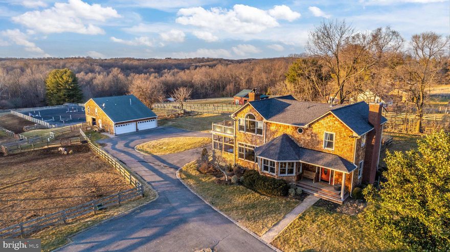 For those who have dreamt of country living, here it is! Grand custom farm house, complete with multiple porches featuring picturesque views: 3,500+ sf cedar shake shingle home, open floor plan; huge gathering room, fireplace, hardwood floors, gourmet kitchen w/granite counters & Aga stove, 3 BD, 2.5 BA, spacious primary suite w/private deck, fabulous views, luxury bath & double walk-in closet.   With 5 acres, there is room for horses or ponies or alpaca or sheep or 4-H project animals! Center aisle barn, 3 matted stalls, feed room, hot/cold wash-stall, heated tack room, laundry room, loft and plenty of storage, heated garage, plus office/studio/bonus finished space over barn/garage. 4 fenced paddocks, 3 run-ins, 85'x185' riding arena with all weather footing. Walk or quick hack by horseback to 6,700 acres of Patuxent River parkland, offering bridle and hiking trails, fishing, hunting, bird watching and more! In vibrant Mount Airy, often voted as one of the “Best Places to Live” in the U.S., with historic downtown shops and restaurants, and plenty of local wineries and farm breweries. Convenient to I-70, easy commutes to 270 Bio-Tech Corridor, to Frederick, Columbia and Baltimore. Only 1 hour to downtown Washington DC.