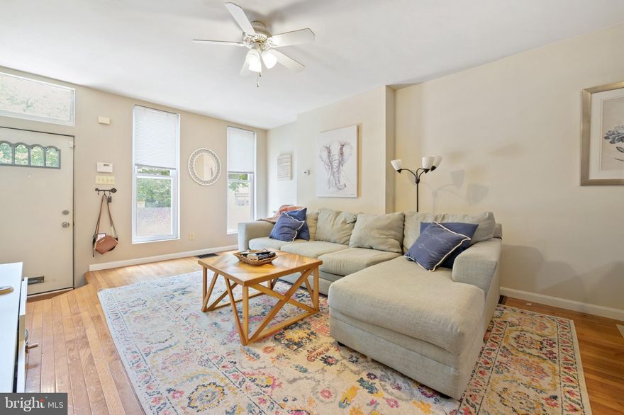 This three bedroom townhome has one full bathroom and one half bathroom with parking and a large basement for storage. Walk in through the front door into the living room where natural hues of hardwood and light gray walls with white trim set the tone for cozy ambiance. Beyond the living room there is a half bathroom, dining area, kitchen, laundry/mud room, and walk out to patio and the easily accessible parking space on the main level. The kitchen flows right off of the dining area giving a great open floor plan for entertaining guests. The basement is large and easily accessible by a stair case giving the owner the option to easily store items in a nice partially finished dry space. The parking off of the back fenced in patio is very wide open as it flows right off of a side street for easy access. The third level has two large bedrooms and one medium sized room all joined by a hallway full bathroom with shower and tub. This home is located in a prime location in the heart of Hampden across from Wyman Park. This home is located close to the I-83 exit, walking distance to the Avenue and Rotunda and is a short distance from John Hopkins university making travel to the campus easy.