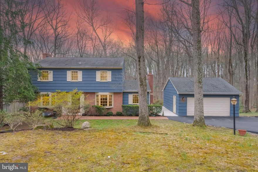 Welcome to 13008 Dulaney Valley Rd. in Glen Arm, MD—an exquisitely maintained home that blends timeless charm with modern comforts. Nestled on a sprawling 4.86-acre wooded lot, this property exudes character at every turn. Inside, enjoy original custom kitchen cabinets with a tile backsplash and a spacious pantry. The home features built-ins in the living room, family room/den, and kitchen. 2 wood burning fireplaces are warm annd inviting focal points for any season and all complemented by spotless hardwood floors on the main and upper levels. Picture windows grace the main level, framing a formal living and dining room. The main level powder room is conveniently off the kitchen. Upstairs, the primary bedroom offers a walk-in closet and full bath, 3 additional bedrooms, plus a full hall bath to serve the additional spaces. The finished basement provides plenty of space for entertaining with family and friends. There's many storage areas in the basement in the utility room where you'll find the laundry room and an extensive water treatment/reverse osmosis system. Step outside to the rear stamped concrete patio and admire the lush gardens with extensive landscaping and a detached two-car garage. Every detail here reflects meticulous care. All of this and no HOA! Don't miss this rare opportunity—schedule your tour today!