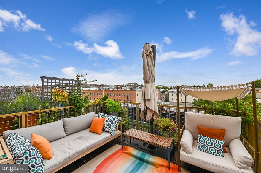 A hidden oasis within walking distance from the Cross Street Market in historic Federal Hill.  Centrally located, Federal Hill’s vibrant dining, bars, shopping, and the Inner Harbor are all just steps from your door.   Soaring 12ft ceilings with exposed ceilings, a spacious open concept, and hardwood floors throughout vibes a NYC loft feel, perfect for creating a home studio. The best part is your rooftop deck with open green space and panoramic city views – it is a city gardener’s dream! A private oasis in the middle of the city where you can relax, have a glass of wine and enjoy your dinner outdoors after a long day at work. Primary bedroom boasts a spacious walk-in closet and a small sitting area. The main living area includes a platform sleeping loft perfect for overnight guests and can be easily converted into a separate bedroom.  An added bonus of the condo is the den area, which can serve as an office or be converted into another bedroom. Open concept kitchen comes equipped with sleek stainless steel appliances, granite countertop, and a breakfast bar. The unit was recently renovated with fresh paint, designer touches, a new garbage disposal, stylish faucets, a platform bed, and a new HVAC ($10k).  Washer/dryer in the unit. Building amenities include a beautiful communal patio, gym, and club room. Seize this rare opportunity to embrace upscale city living with all the comforts of home and one of the lowest condo fees in the area.

Seller is gifting the buyer one year paid parking!

A rare combination of city living with the opportunity to have a large private patio garden and this building is very pet friendly.
