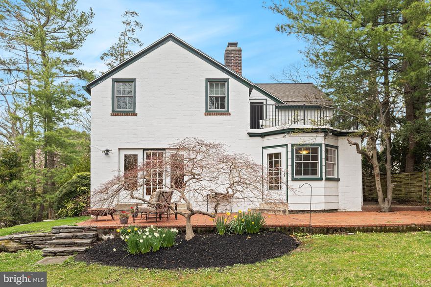 If you’re looking for the bucolic charm of the suburbs with the walkability of a quaint Main Street and easy access to the city, welcome to your storybook home in the heart of the Main Line. This one-of-a-kind detached home offers the enchanting character of the French countryside. It’s the perfect blend of serene living and urban convenience—ideal for those who crave a peaceful lifestyle with a walkable, small-town feel.

Just a 15-minute stroll leads you to the Wynnewood Station, offering direct access to the city. An even shorter 10-minute walk brings you to Whole Foods and an array of shopping, dining, and fitness options. If you’re feeling adventurous, a 22-minute walk (or 5-minute drive) will take you to Suburban Square, described as "a modern-day lifestyle destination with a curated mix of modern, classic, and cool retail offerings and unique dining options. The Square is the Main Line's go-to destination to escape the everyday."

Your future home is thoughtfully situated lengthwise on a large lot overlooking a three-acre preserve owned and maintained by Lower Merion Township. Picture yourself relaxing in the morning on the brick patio off the den and kitchen, savoring a steaming cup of coffee while listening to birdsong and watching wildlife scamper about. Life is good in Wynnewood.

Be welcomed home through the inviting front door or the convenient two-car attached garage. Step into a warm and welcoming entryway featuring a useful coat closet where life’s daily essentials can be tucked away. The entry frames the main staircase leading to the second floor, conceals the basement stairs behind it, and guides you to the formal living room or a private fourth bedroom with an en-suite bath—ideal for guests, an au pair, or in-laws.

Continue through the charming library alcove and butler's pantry (complete with laundry facilities) to reach the heart of the home: the kitchen. With rustic touches and ample space for gathering, this dine-in kitchen is perfect for crafting culinary masterpieces and hosting memorable dinners framed by a view of the preserve beyond. The kitchen connects seamlessly to the family room—a warm and inviting space wrapped in built-in bookcases, cabinets, and a cozy fireplace. Whether you're entertaining, unwinding with a book, working from home, or playing music with friends, this room is destined for memory-making.

The finished basement offers two versatile rooms perfect for a casual living space, home theater or game room, gym, multiple home offices, media room, or hobby space. Additionally, the ground floor provides a storage and utility room with direct access to the garage—ideal for housing a potting station, sports and camping equipment, paddle boards, scooters, and seasonal items.

Upstairs, you'll find three generously sized bedrooms, including a spacious primary suite with its own private balcony overlooking the tranquil preserve. Each bedroom includes ample closet space, while the hall bath leads to an expansive storage room that would make a great sauna or provide even more organizational options.

This home has been lovingly maintained with thoughtful updates throughout, including Pella windows, an upgraded HVAC system and hot water tank, a newer roof, refreshed exterior woodwork, and revamped pavers along the walkway. The private balcony has also been tastefully enhanced, adding to the home’s timeless charm.

This property is a perfect canvas for your personal touches—a place where modern convenience meets classic comfort, and every corner invites you to relax, gather, and make memories. Life is good in Wynnewood, and this home is ready to show you just how sweet it can be. Come and live it.