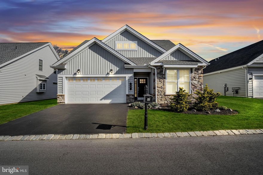 Popular 3-bedroom, 3-bath Betsy Ross II model located in the highly sought-after active adult community of Traditions of America at Silver Spring. This spacious home offers open-concept design and main-floor living at its finest, thoughtfully enhanced with numerous upgrades throughout.
Luxury vinyl flooring flows seamlessly through the main living areas, creating warmth and continuity. The designer gourmet kitchen showcases modern finishes, including granite countertops, a breakfast bar island, upgraded Yorktowne cabinetry, tile backsplash, upgraded stainless steel appliances with a dual-fuel range, and stylish designer fixtures.
The open floor plan is ideal for entertaining, connecting the kitchen, dining area, and expansive great room. A cathedral ceiling and stunning stone fireplace anchor the great room, which is open to the loft above. Large windows flood the home with natural light. Step outside through the great room to a fenced, oversized paver patio spanning the rear of the home—perfect for grilling, relaxing, and hosting friends and family.
The primary suite features a tray ceiling, two closets, and a spa-like bath with heated tile floors, infinity shower, and double vanity. A second bedroom with a full bath, along with a convenient laundry room, completes the main level.
Upstairs, you’ll find a private guest suite with bedroom and full bath, plus an additional family room overlooking the first floor. An office (or craft room) and ample storage space complete the upper level. The two-car garage offers extra storage as well.
Enjoy resort-style living with an impressive clubhouse featuring indoor and outdoor pools, fitness center, gathering room, library, media center, bar, billiards, craft room, sauna, spa, tennis courts, pickleball, putting green, and bocce courts. Lawn care and snow removal are included—giving you more time to enjoy everything this exceptional community has to offer.
Come experience the lifestyle of Traditions of America at Silver Spring for yourself.