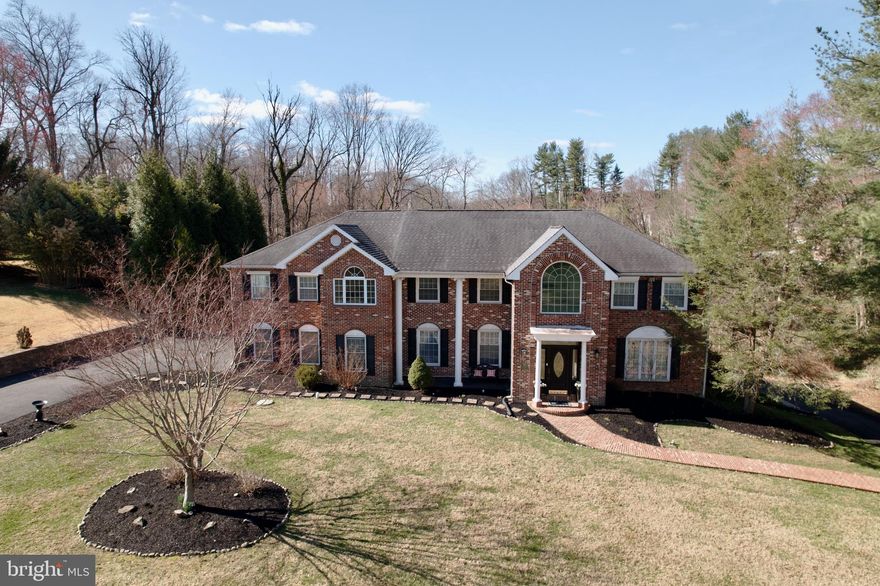 This exceptional residence in Media, PA sits privately on an almost one-acre lot within the award-winning Rose Tree Media School District. The home offers a seamless blend of luxury, comfort, and thoughtful design across its indoor and outdoor living spaces.
 
A grand foyer leads into the main level, where rich hardwood floors and elegant finishes create a warm, inviting atmosphere. The formal living room, anchored by a gas fireplace, flows effortlessly into the dining room, making it ideal for entertaining. At the heart of the home is a beautifully redesigned chef’s kitchen featuring high-end appliances, custom cabinetry, and a spacious layout that opens to a bright family room with floor-to-ceiling windows and abundant natural light. On this level, a powder room and den featuring a beautiful stone wall and marble mantel gas fireplace. Both the den and family room provide direct access to the expansive deck,—perfect for relaxing or hosting gatherings year-round.
The primary suite serves as a private retreat, offering a gas fireplace, generous walk-in closet, and a spa-like en-suite bath with a soaking tub and walk-in shower. The upper level also has five large bedrooms and two bathroom at each end of the floor. An attic provides storage from one end of the home to the other.
 
The basement level is designed for both entertainment and functionality, featuring a full kitchen, bar area with a professional-grade billiards and game room, and ample space for recreation. This level also includes a bathroom with shower and a large living area with a gas fireplace and has three French doors that leads to a patio area and driveway/carport.
Car enthusiasts and hobbyists will appreciate the three-car garage and two-car carport for all the cars and toys,  along with a Generac generator for added peace of mind.
 
Step outside to a true backyard oasis. The property boasts a large pool, expansive paver patio, and a charming upper yard retreat overlooking the grounds. Multiple seating and dining areas, along with a cast iron bistro set overlooking a running stream, create an inviting space for outdoor living and entertaining. The Tex deck is attached to a beautiful hexagonal gazebo that is enchanting and overlooks the pool from the second level. A stroll through the yard leads to numerous treasures, including a built-in gas grill with bar area, waterfall flowing down the hill, little gardens with perennials and a goldfish pond.
Offering a rare combination of elegance, privacy, and resort-style amenities, this remarkable property is conveniently located just minutes from Ridley Creek State Park, as well as top dining, shopping, hospitals, and major routes.